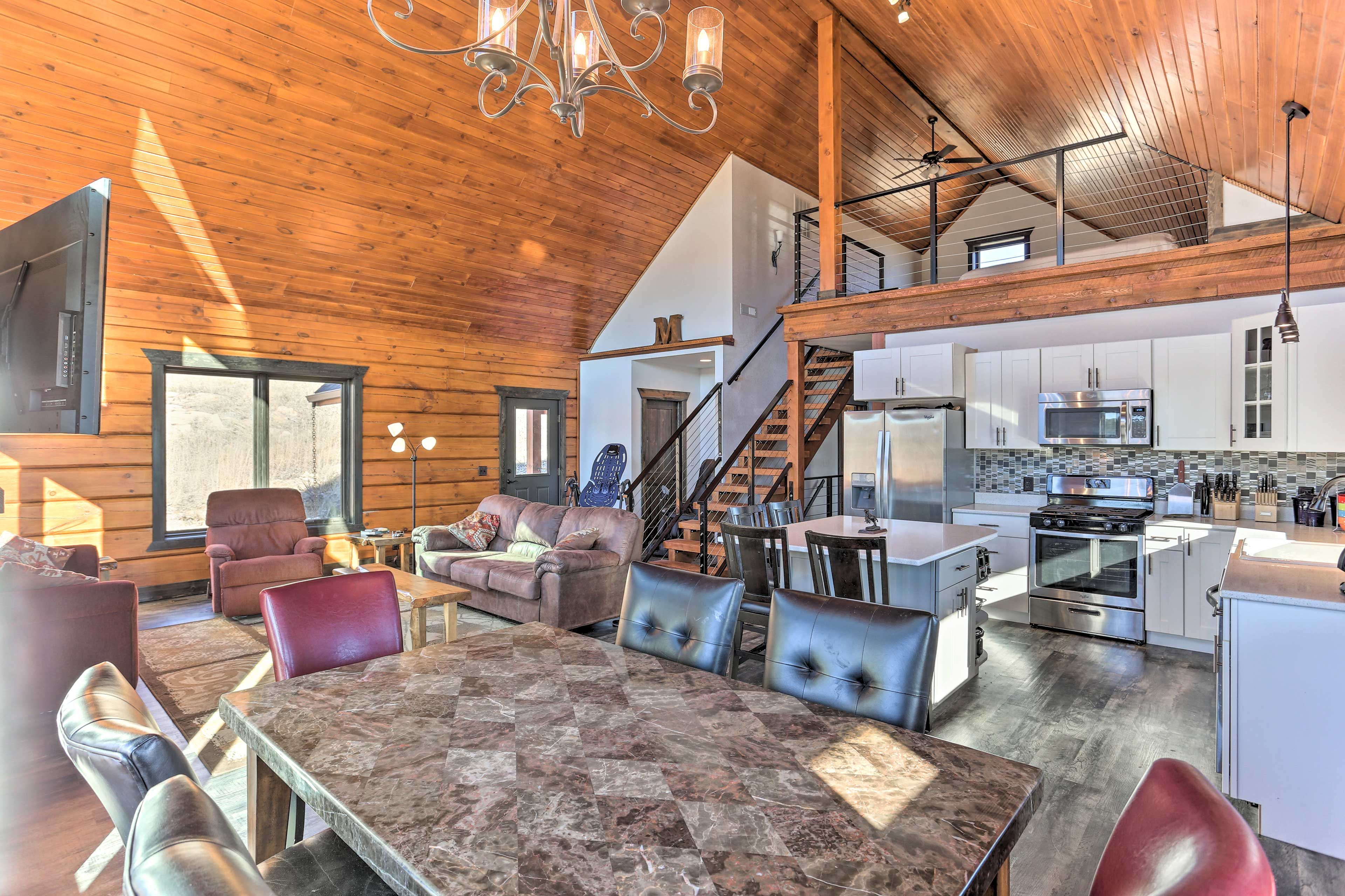 Vaulted wooden ceilings extend over the open concept space.