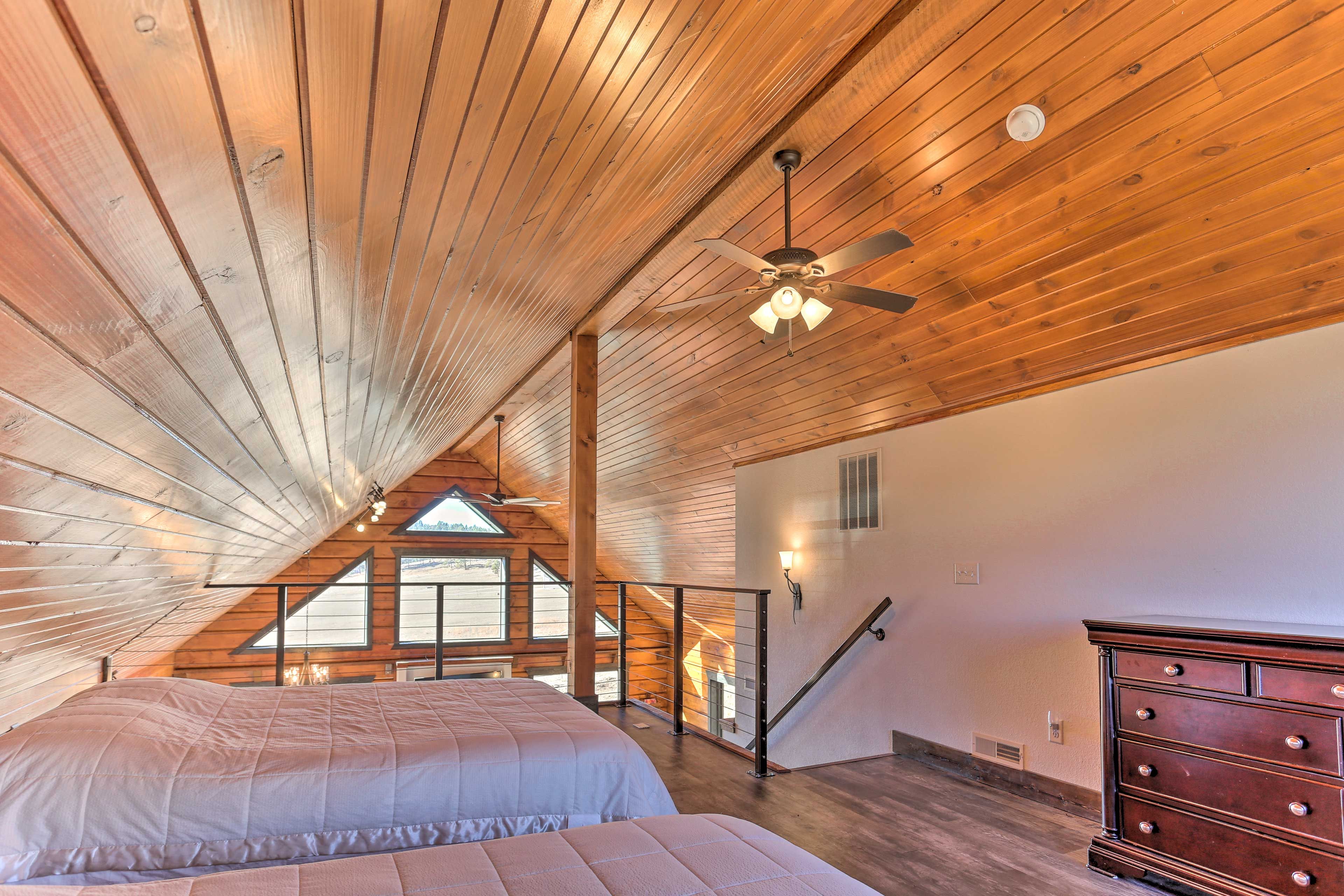 Upstairs, the loft boasts 2 queen beds.