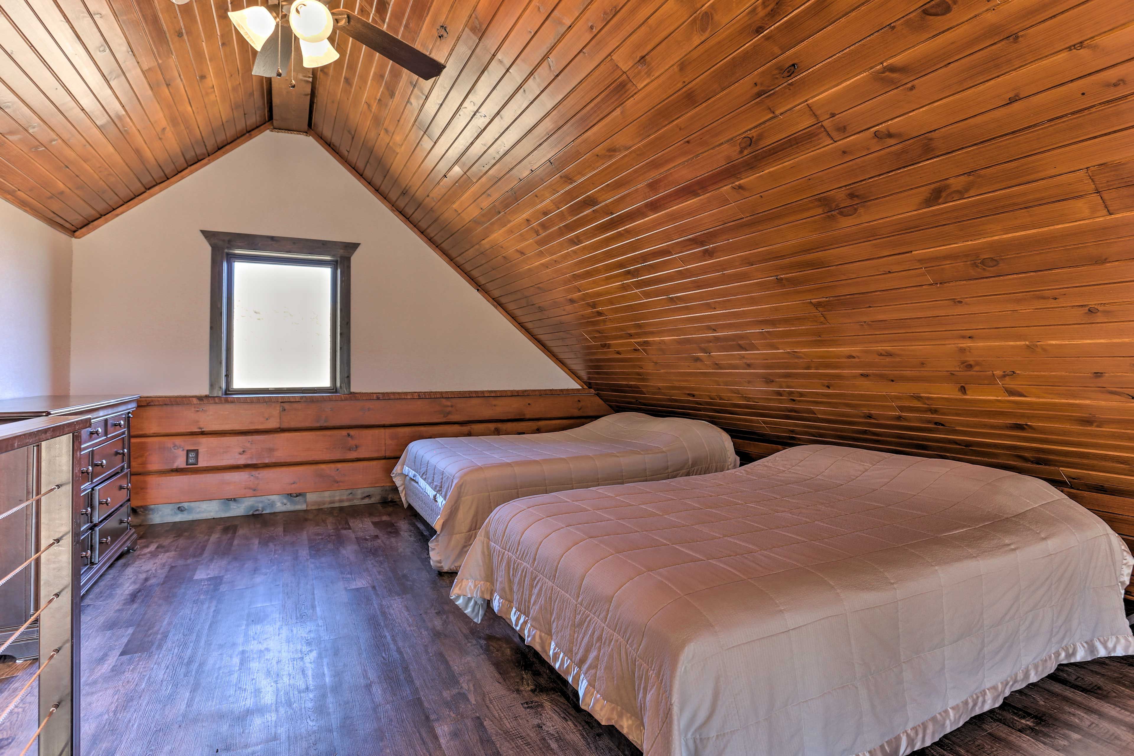 Natural light and ample storage outfit the loft area.