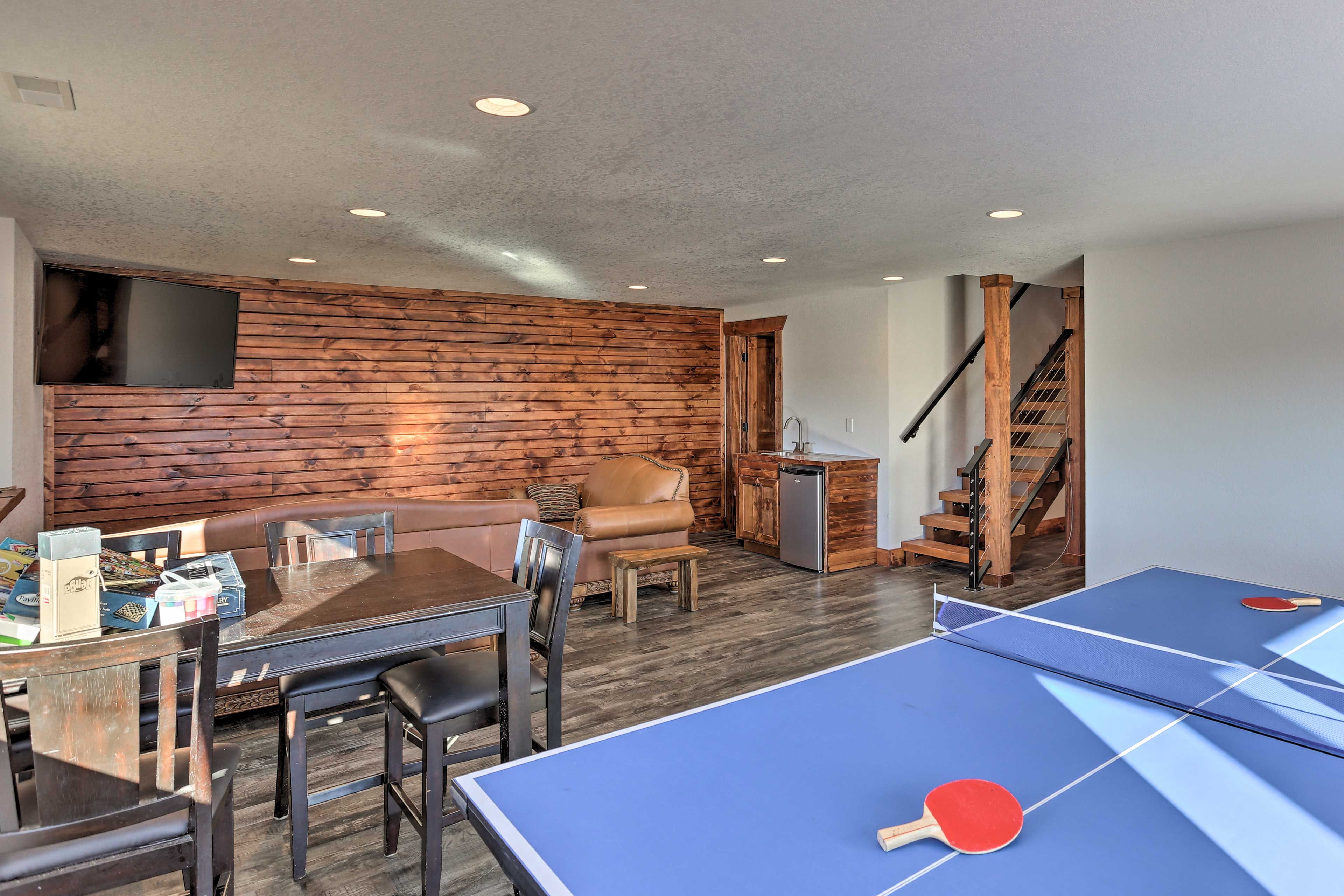 Downstairs, you'll find a separate lounge area with a ping pong table!