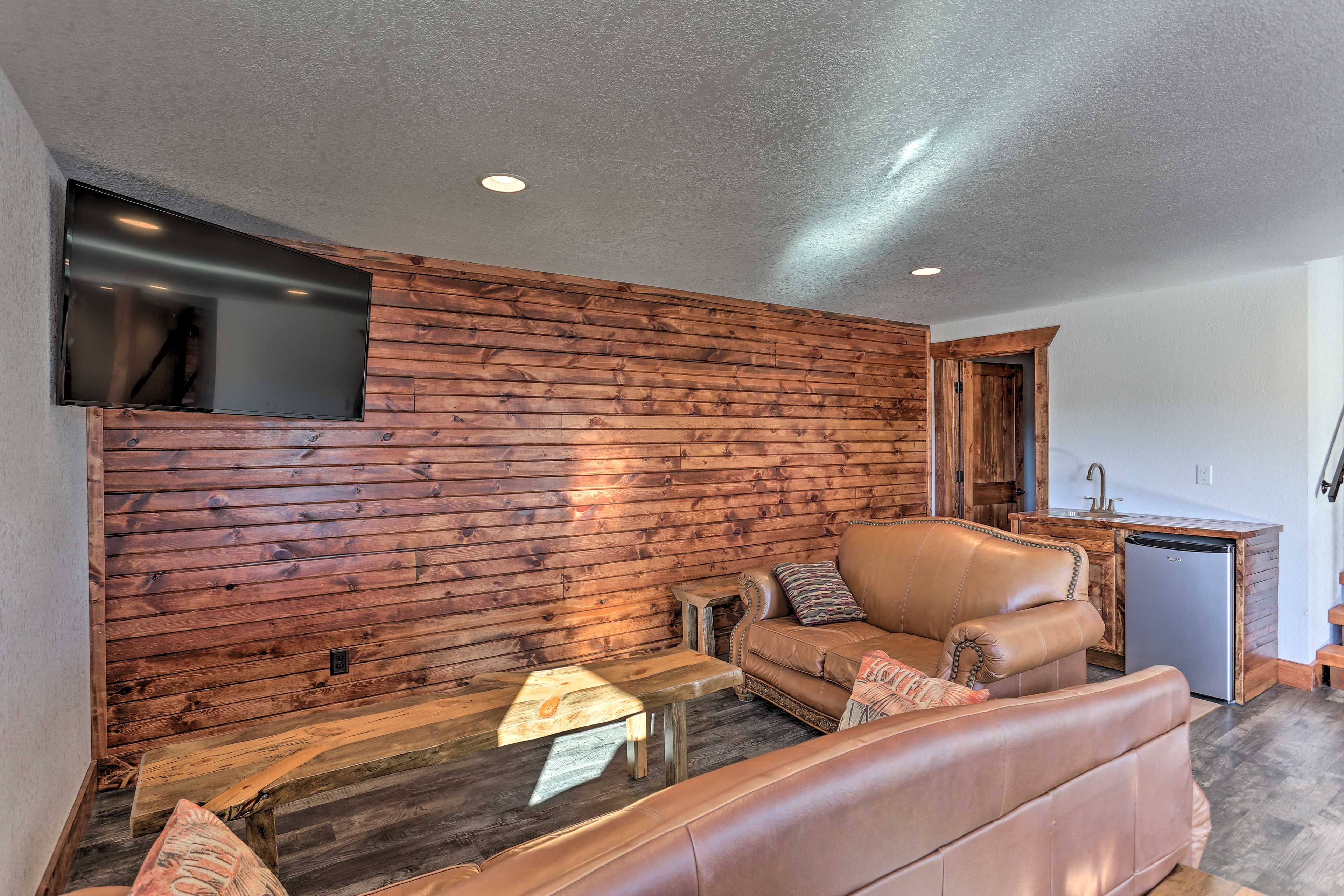 Kick back on the leather seating in front of the flat-screen TV.