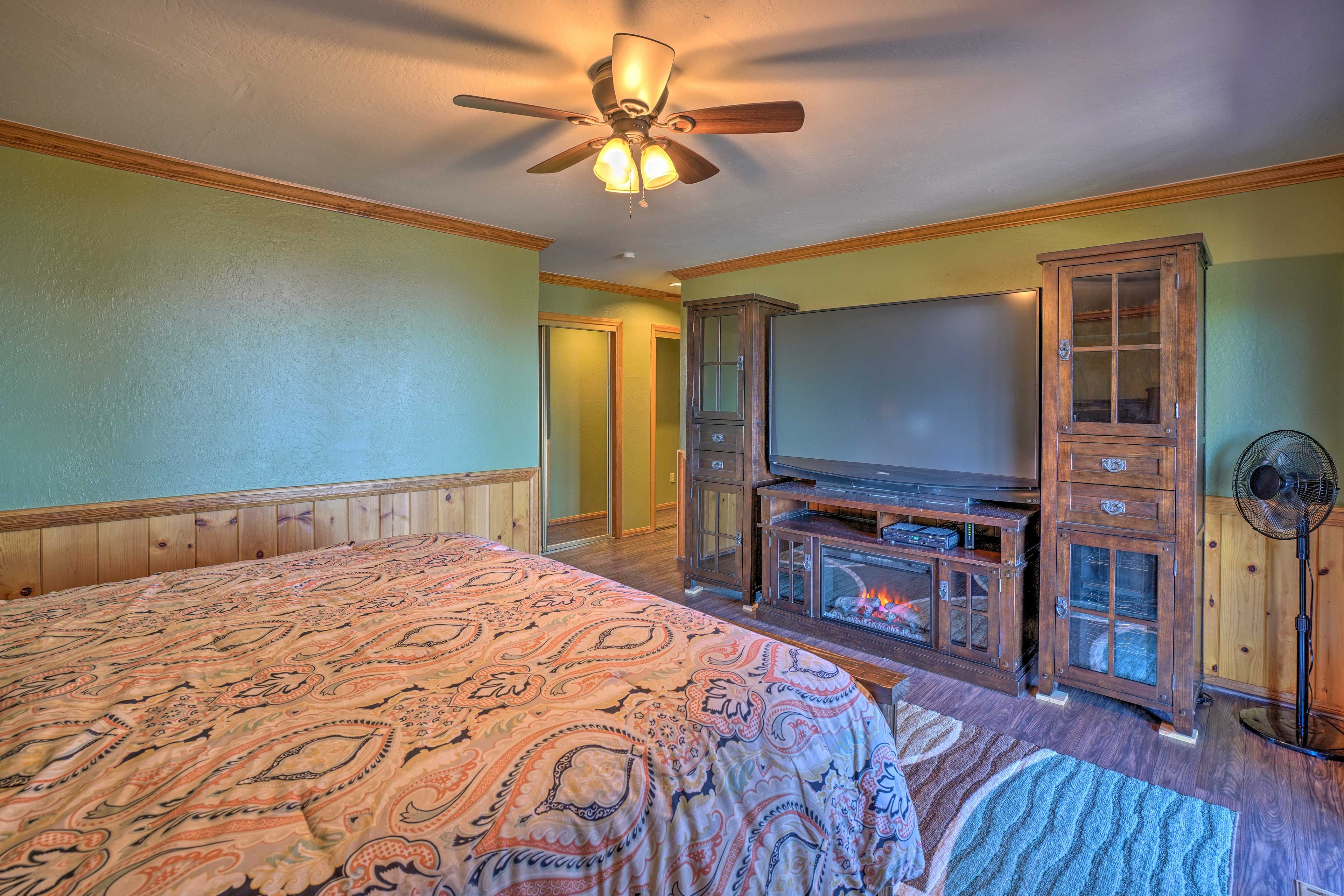 Delight in a movie on the massive flat-screen TV from the comfort of your bed.