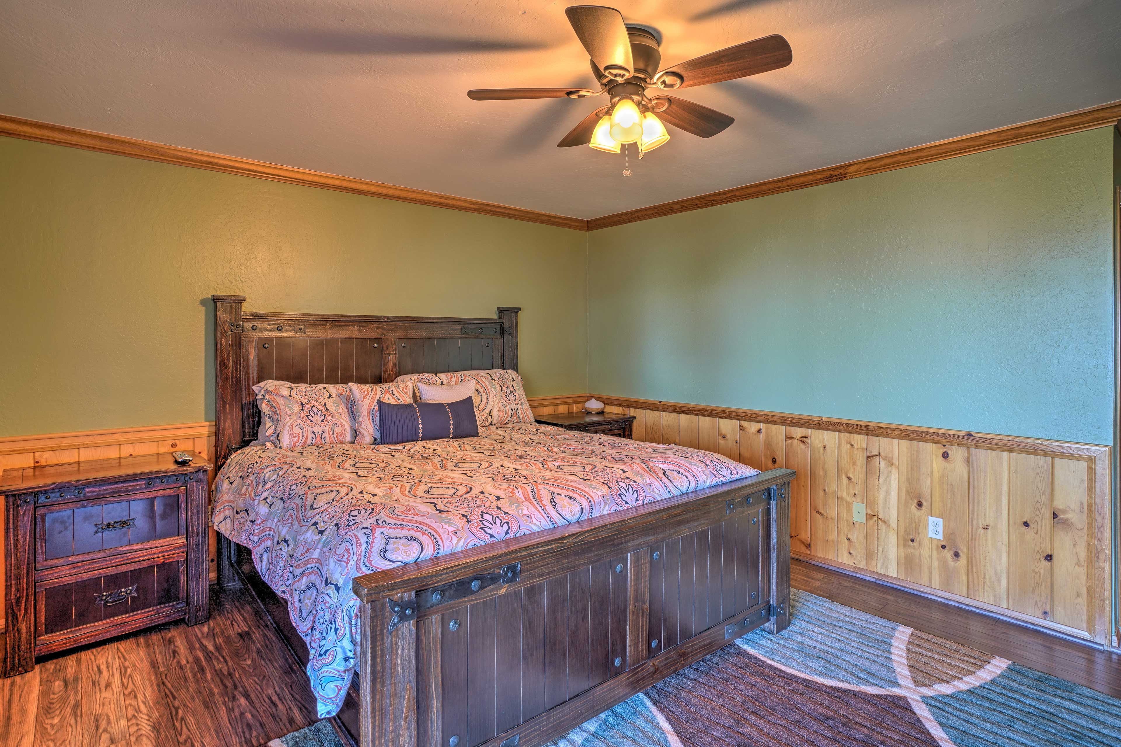 This bedroom welcomes you in with a king-sized bed.