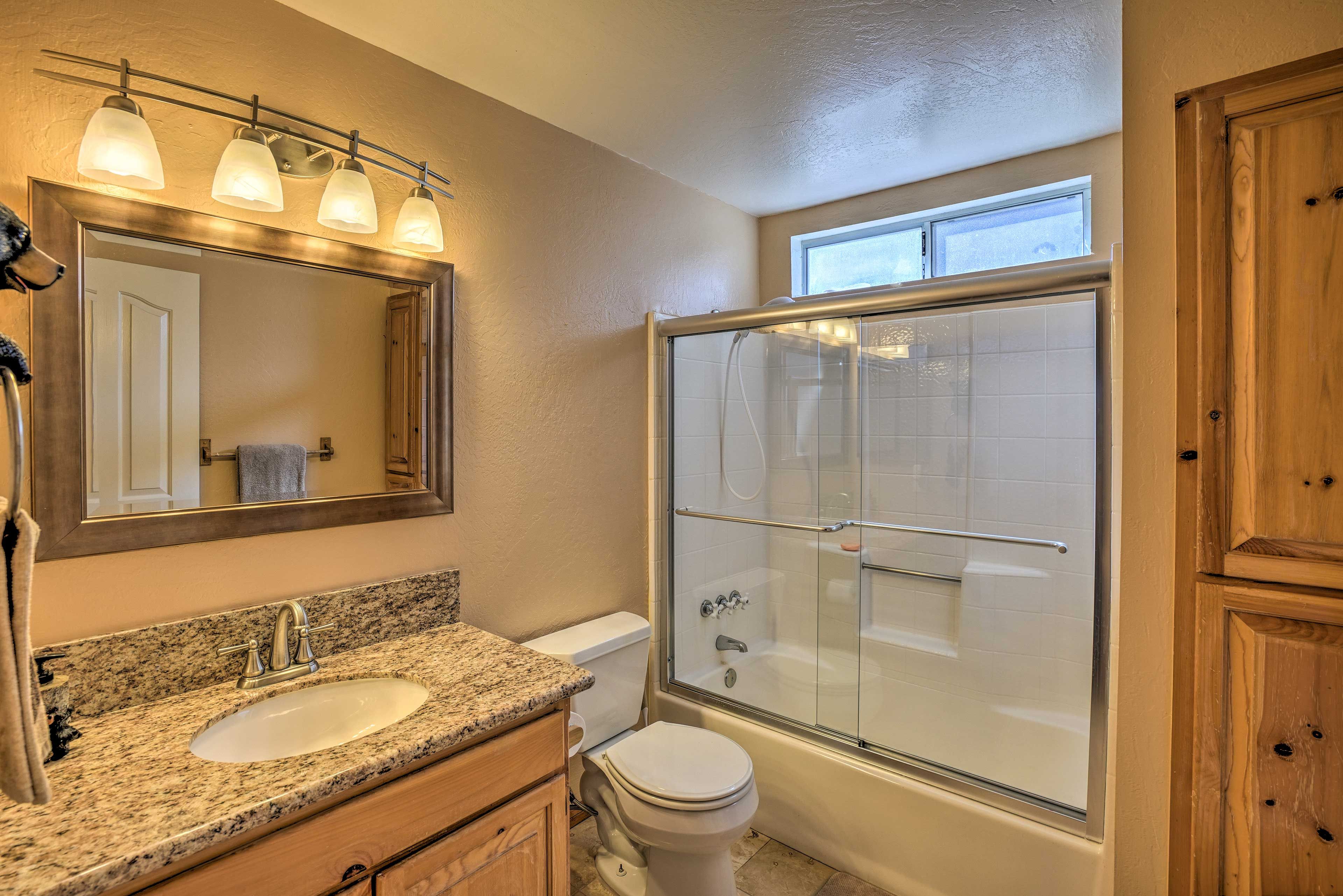Clean up easily in this bathroom with a shower/tub combo.