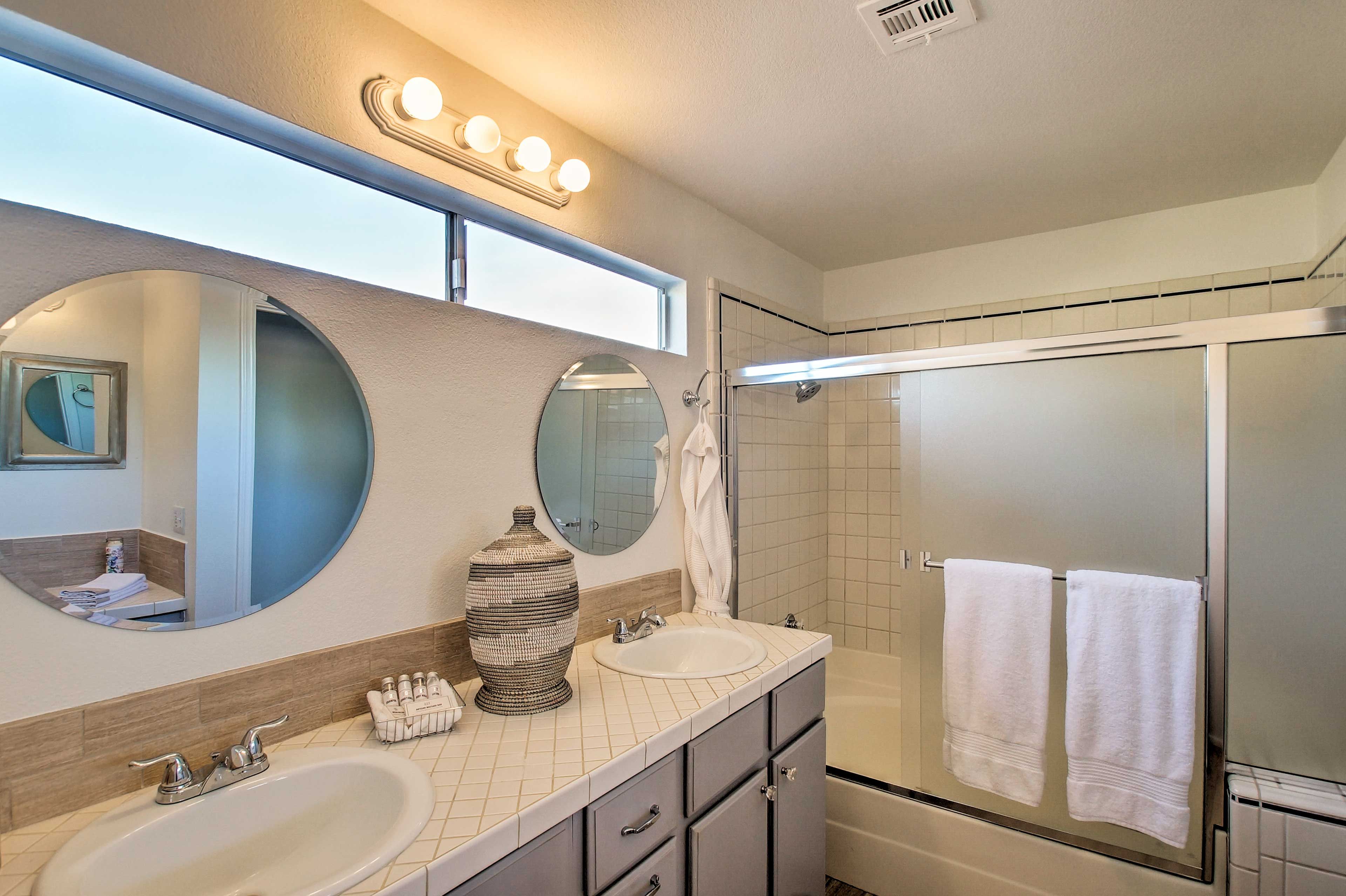 Rinse off the day in the first full bathroom with dual vanities.