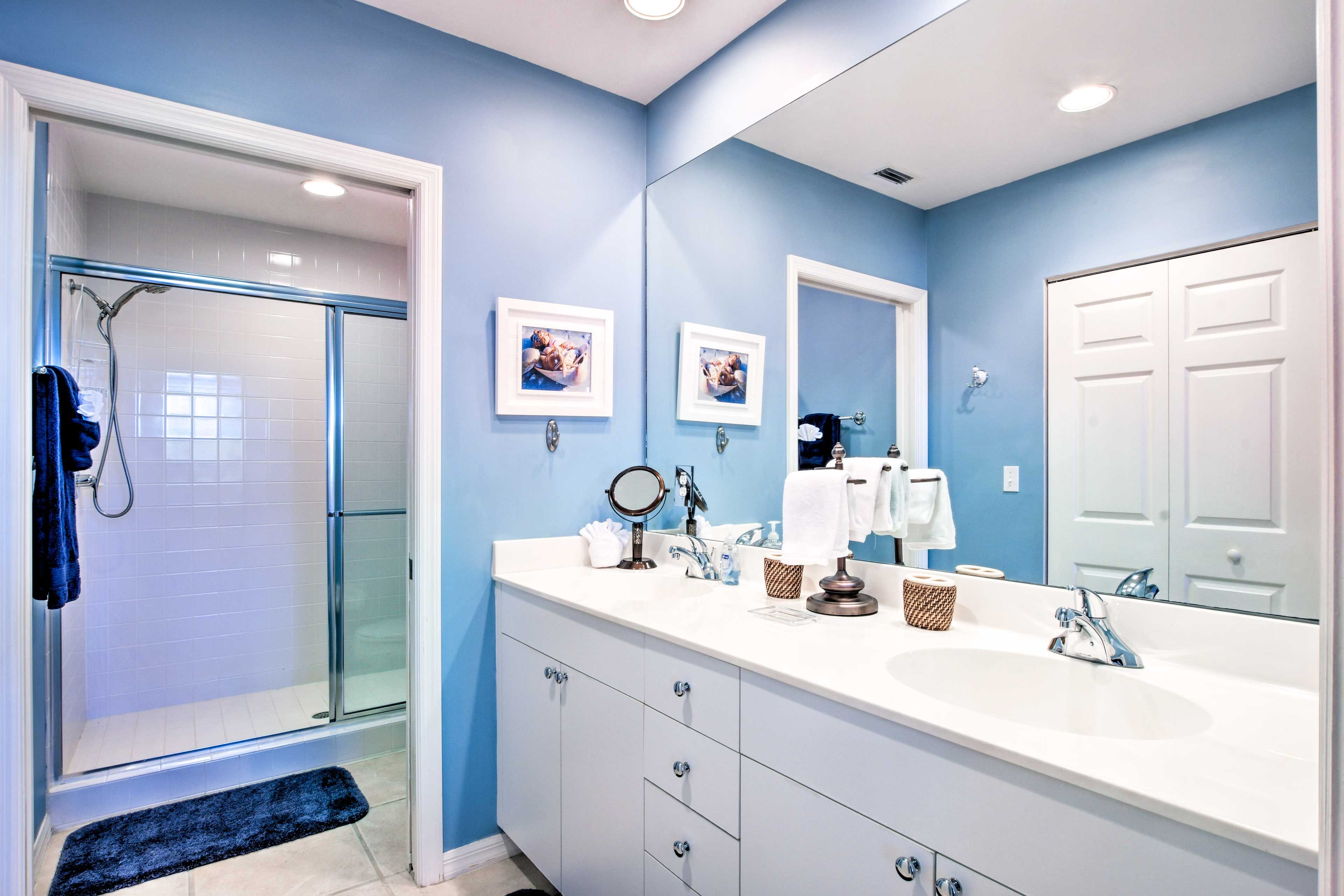 The en-suite bath includes spacious double sinks & a walk-in shower.