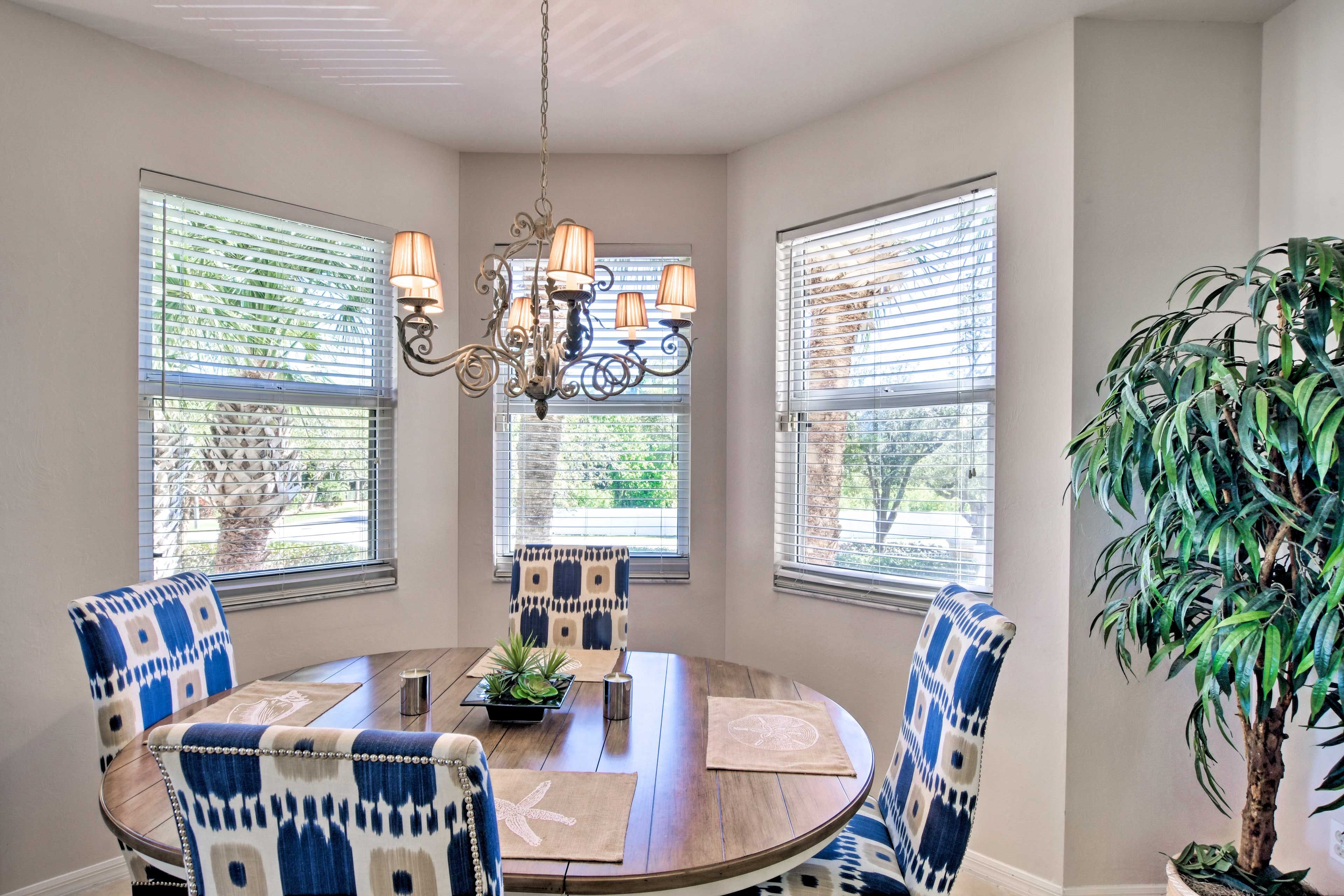 The 4-seat dining table is ideal for enjoying meals with friends and family.