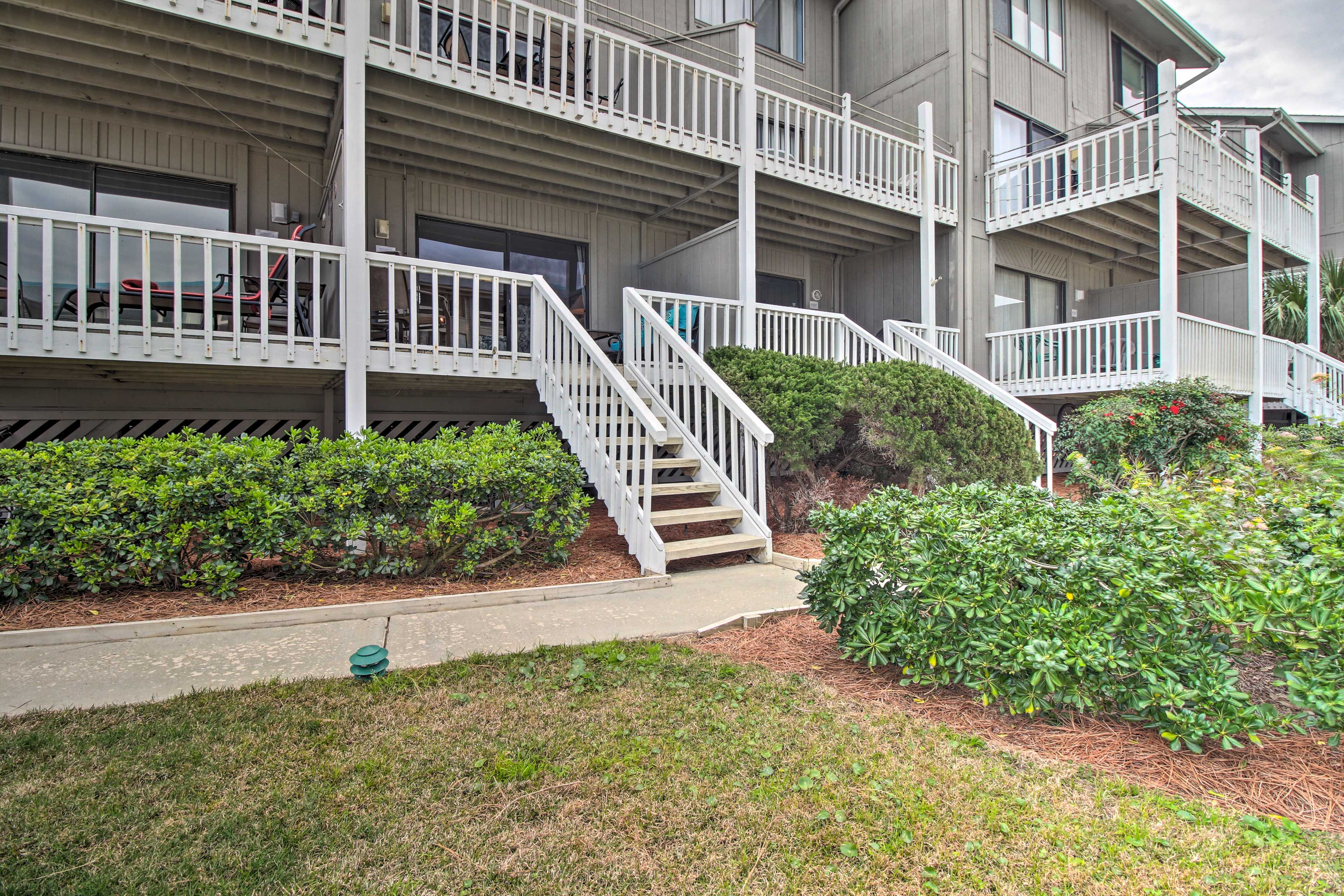 Entrance | Parking | Community Lot (1 Vehicle w/ Complimentary Pass)