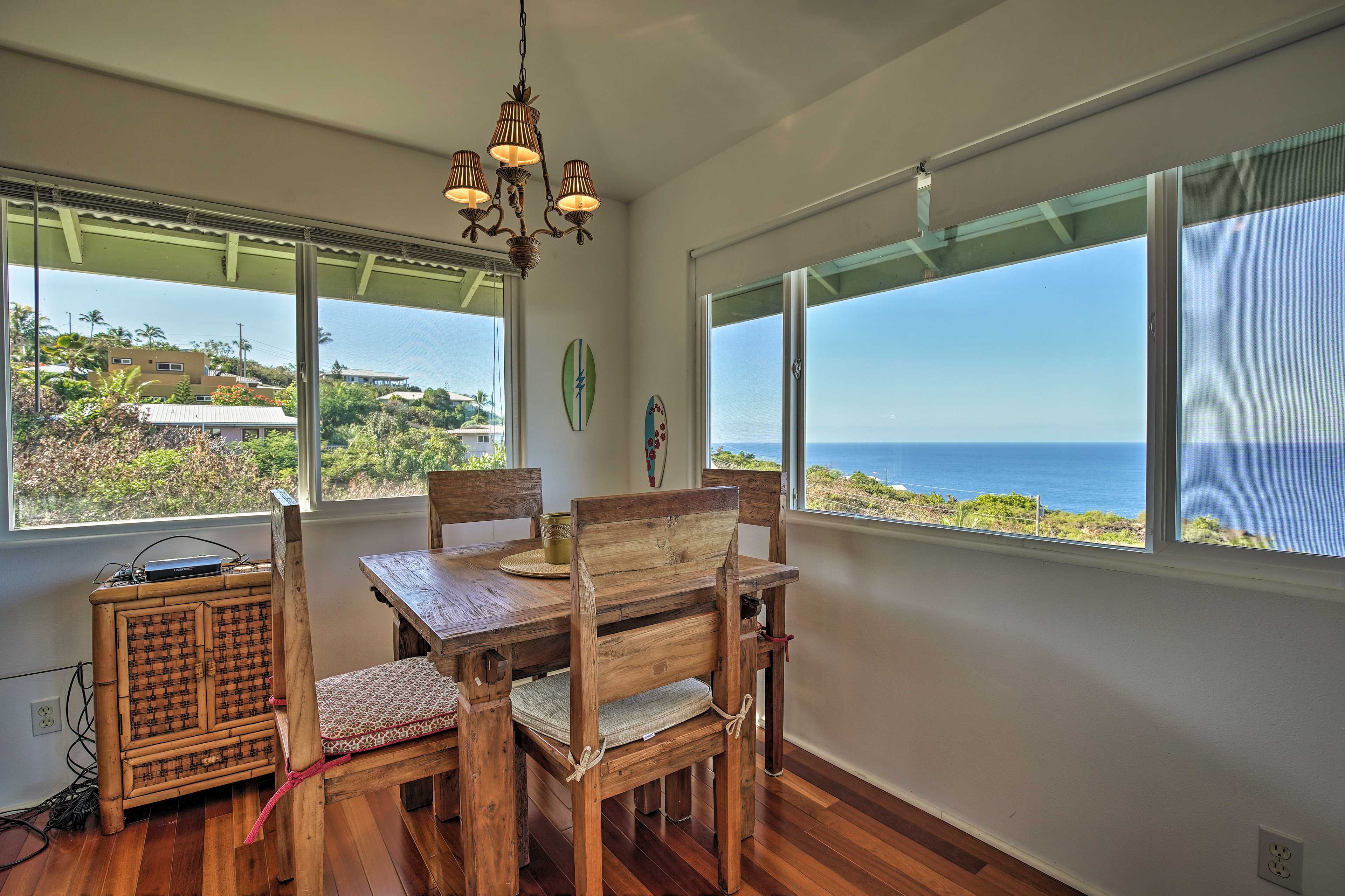 Gather the group for a family dinner around the oceanfront dining table.