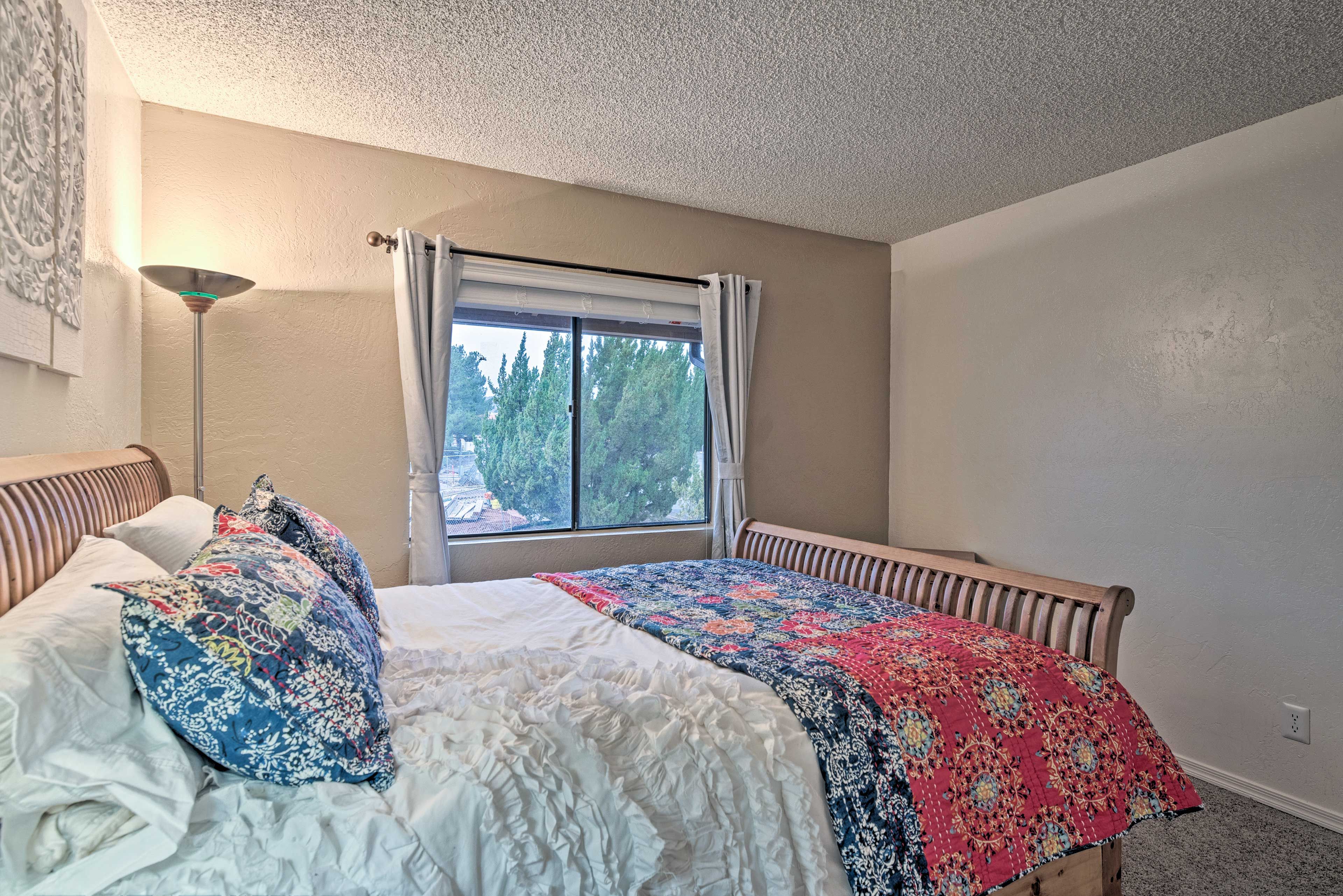 Snuggle up for a relaxing night of rest in the bedroom's queen-sized bed!