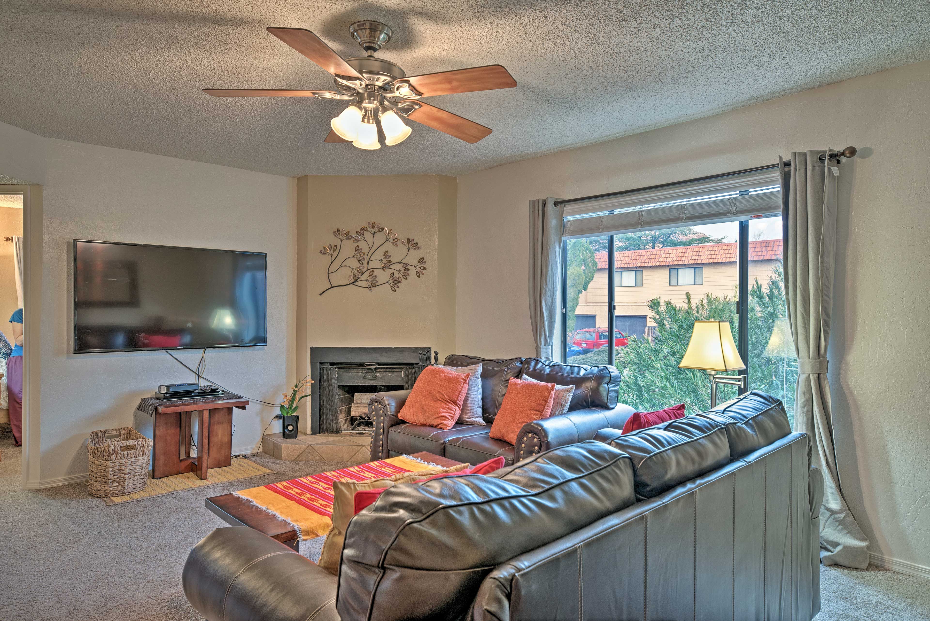 Settle into the leather sofa to watch shows on the flat-screen TV.