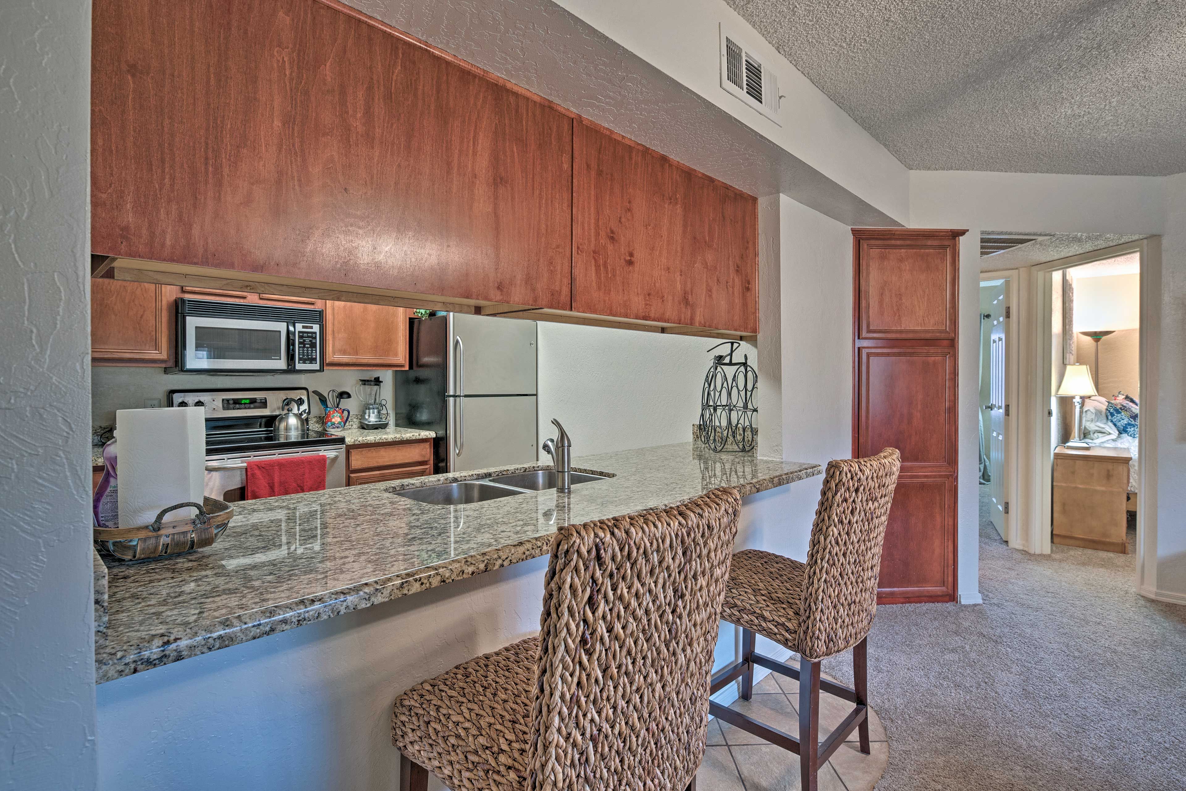 Pull up a seat and enjoy a snack at the kitchen's counter top.