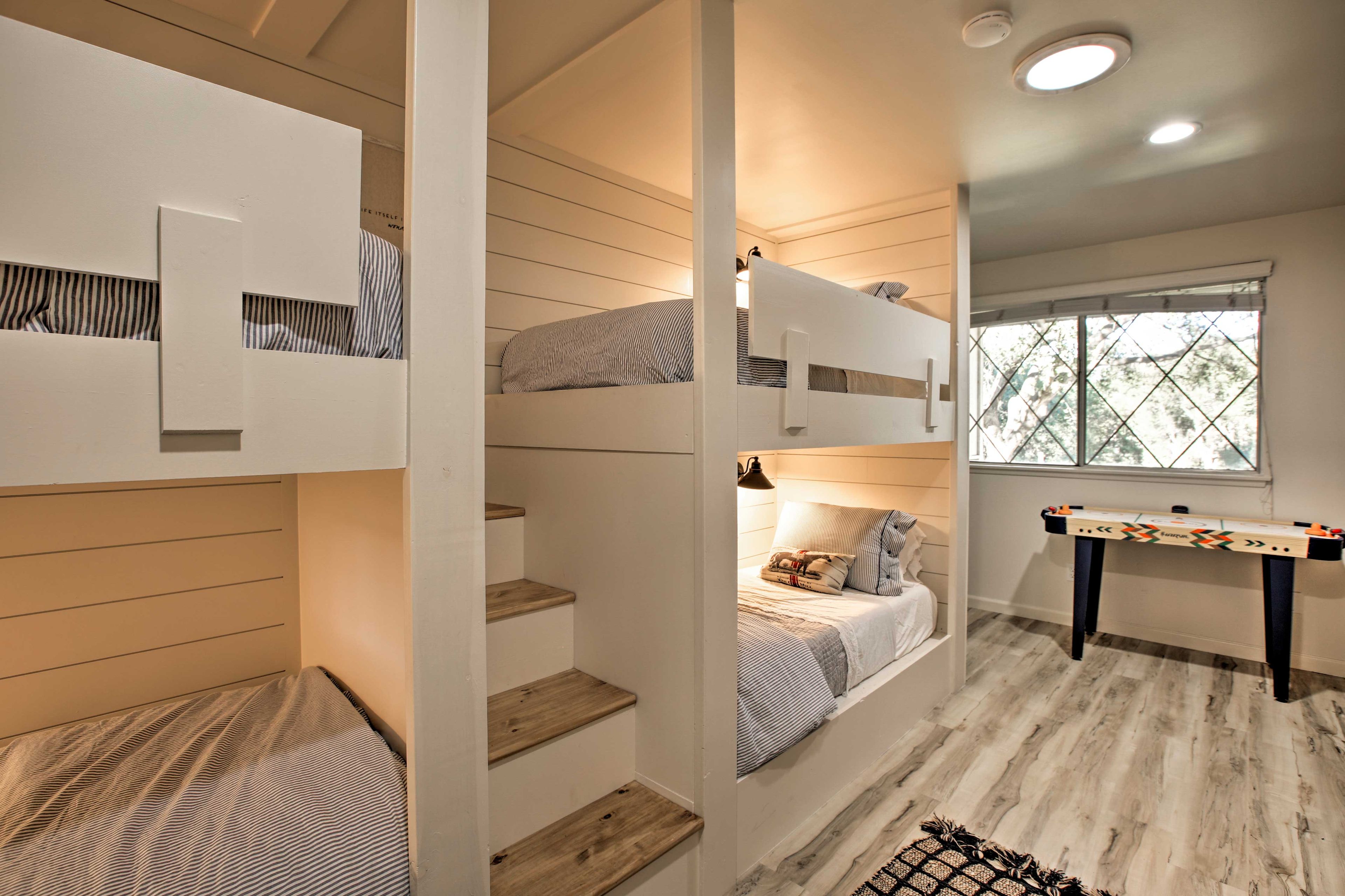 There are 2 twin-over-twin bunk beds and an air hockey table!