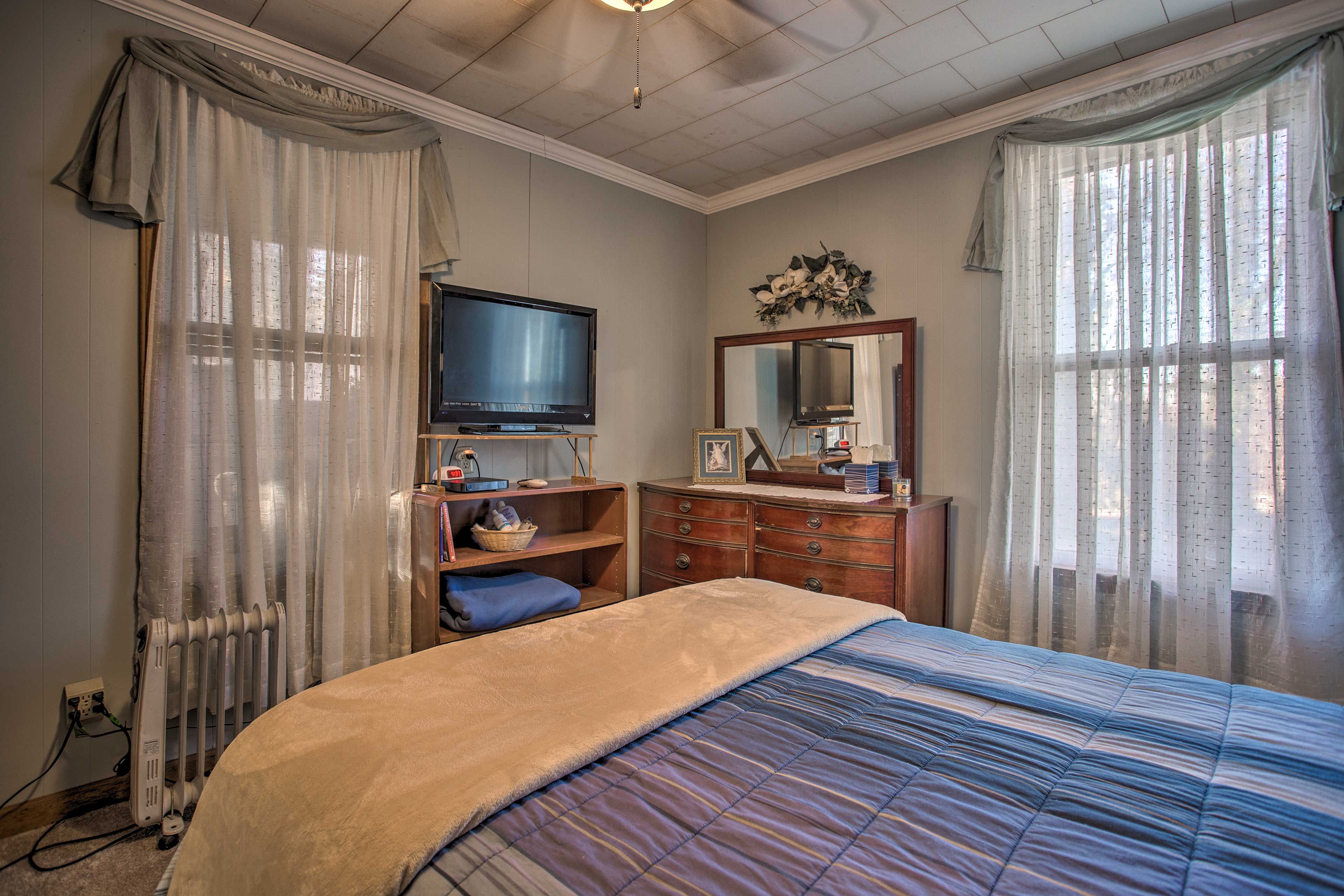 Watch a movie before falling asleep in the master bedroom.