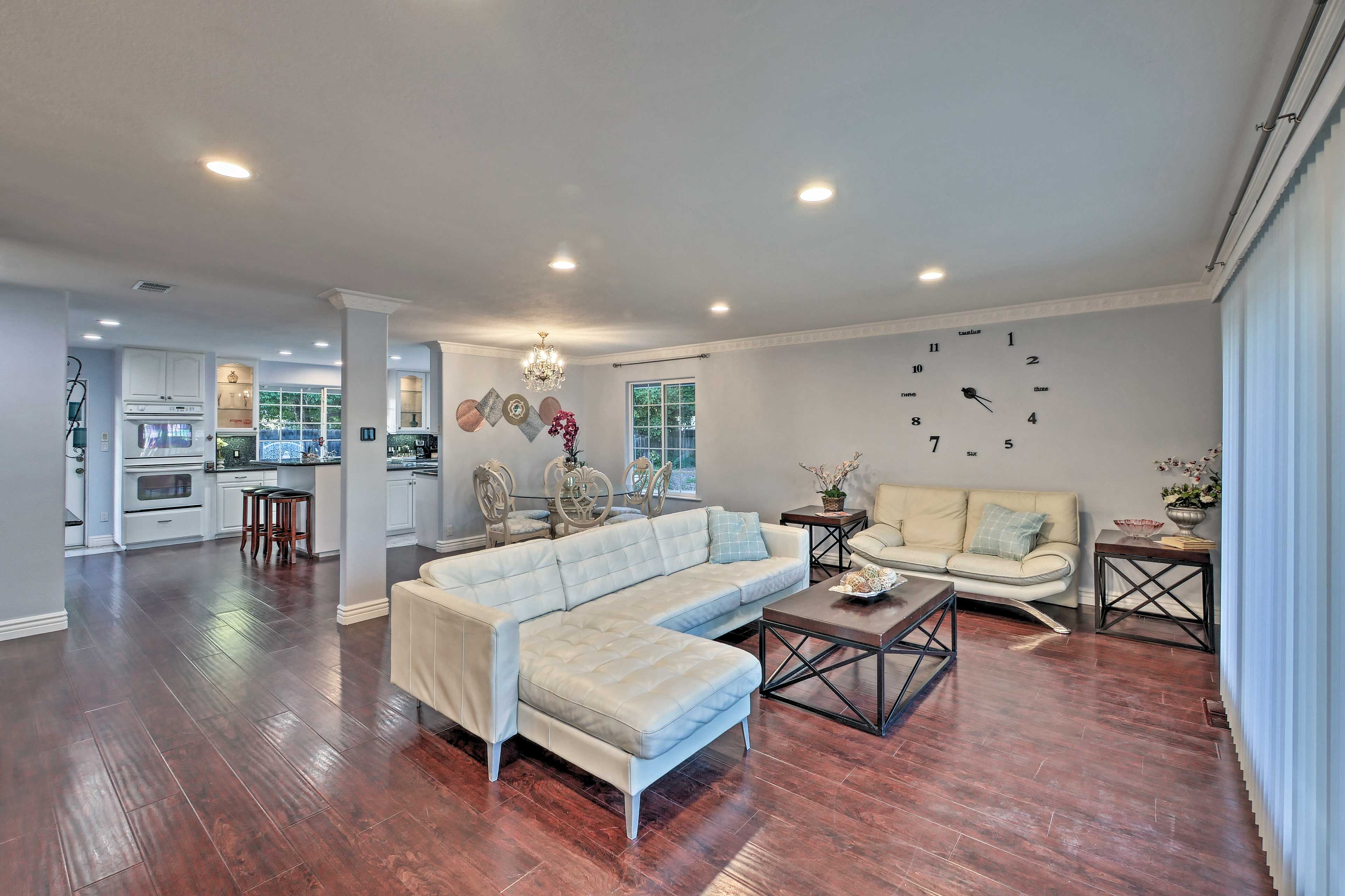 The open-concept living space is highlighted by tasteful, modern decor.