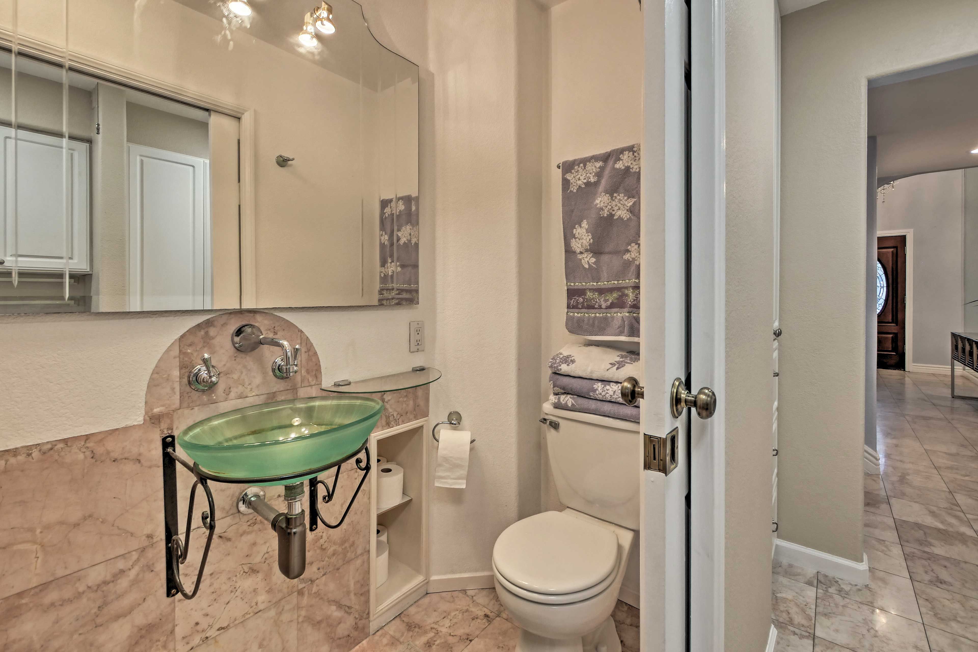 The home includes 3 full bathrooms and 1 half bath.