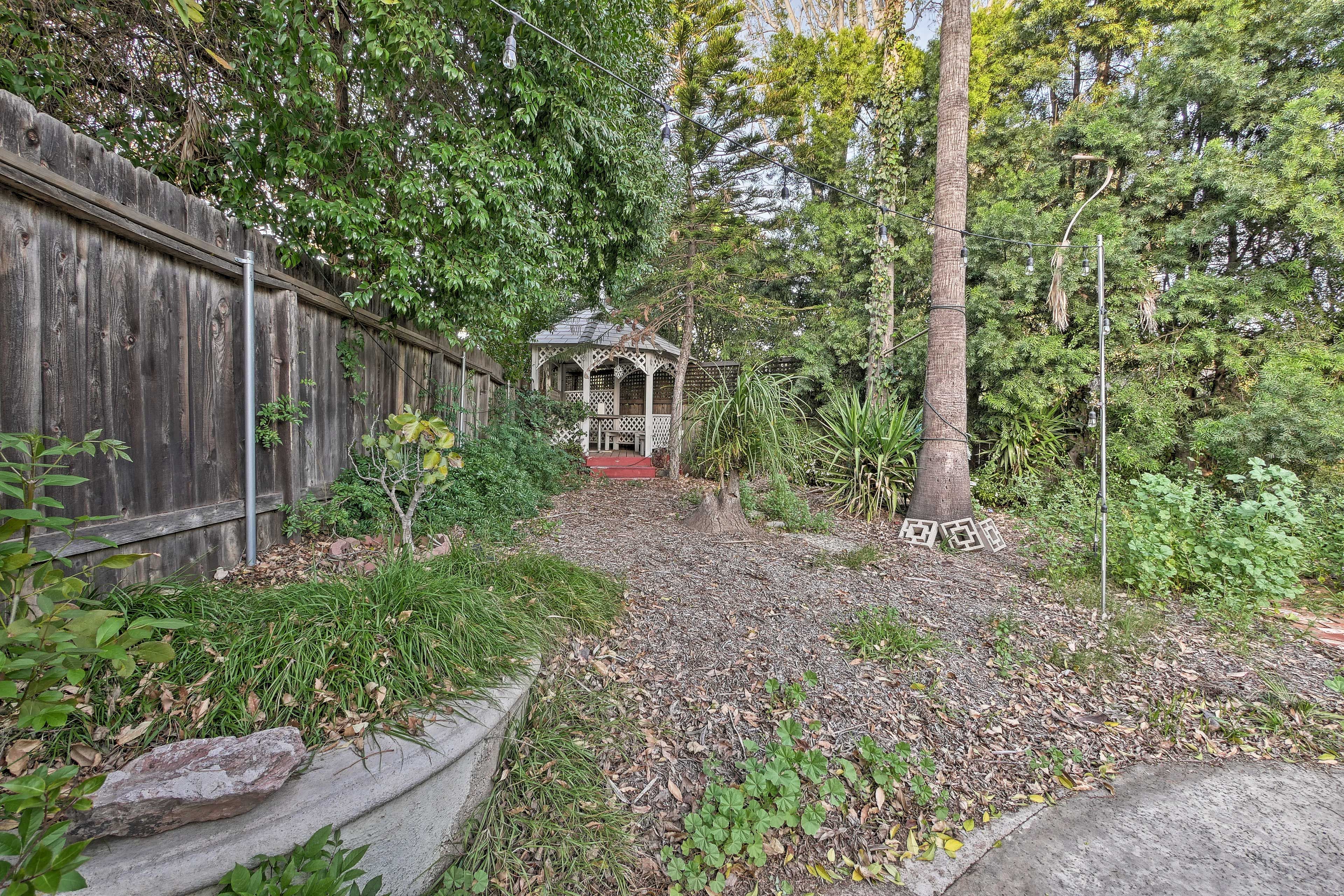 Kids will love playing games in the gazebo, hidden in backyard's foliage.