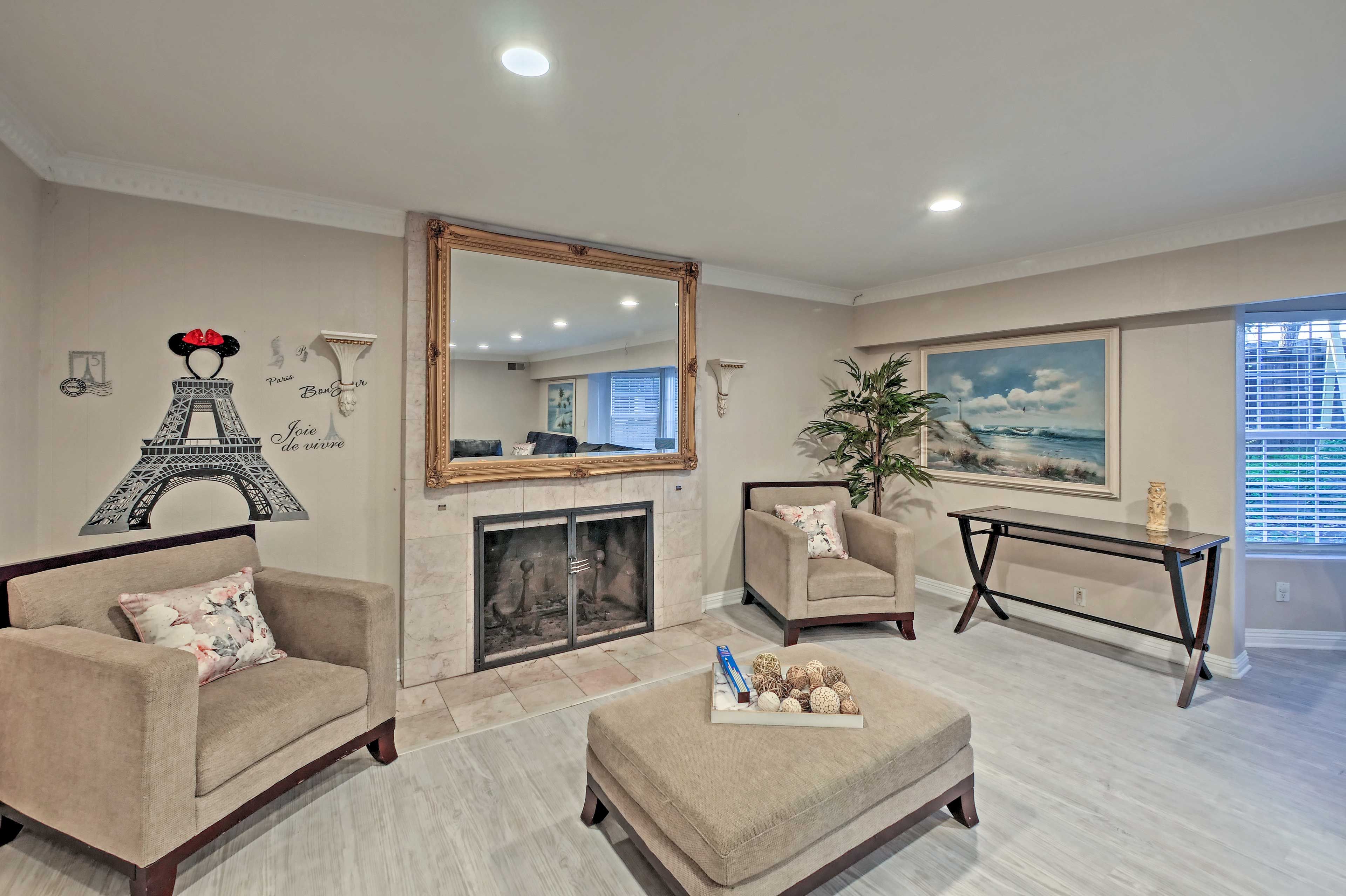 Let the fireplace's flickering flames keep you cozy during your movie night.