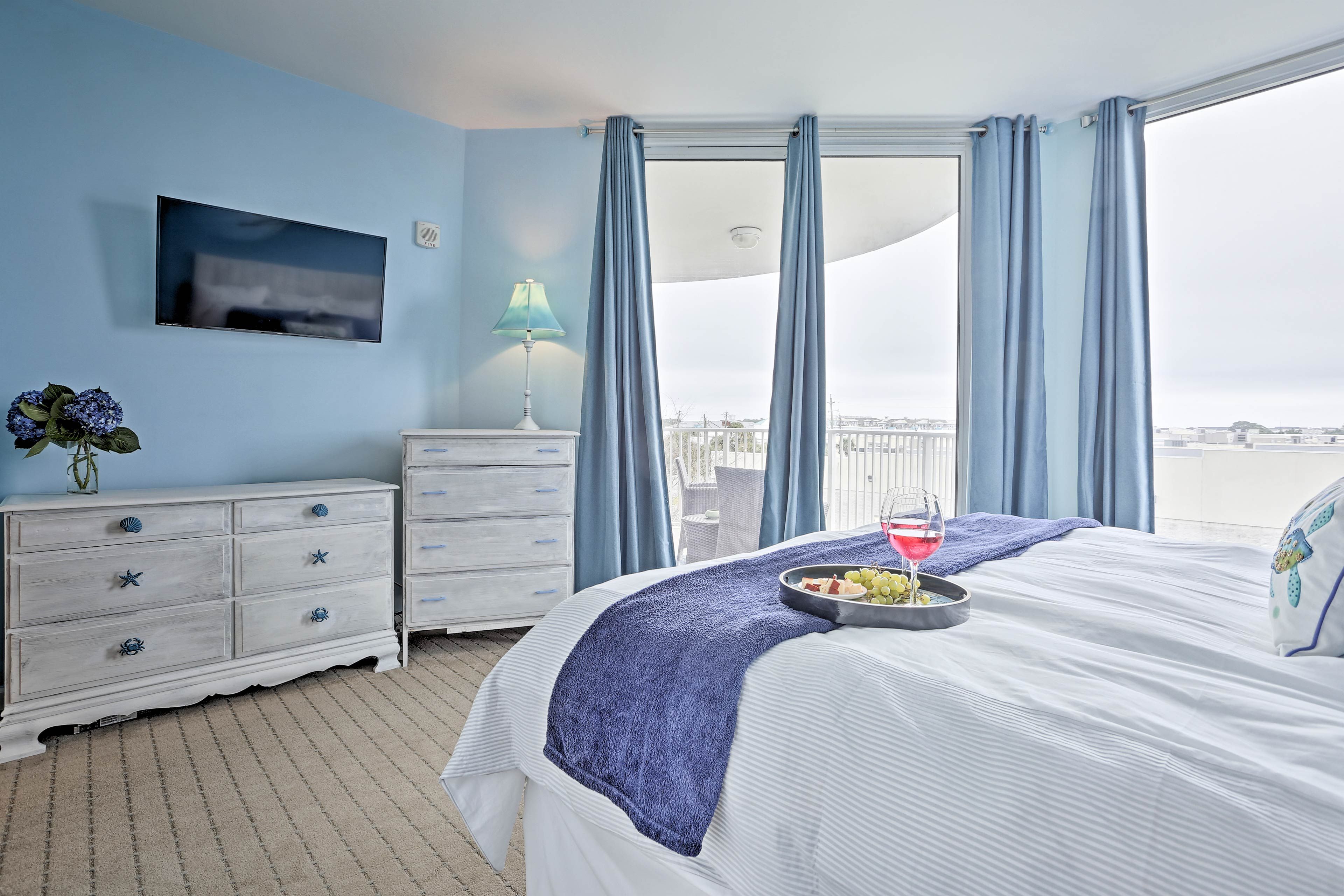 Enjoy a drink, snack, and movie on the flat-screen TV - all from the king bed!