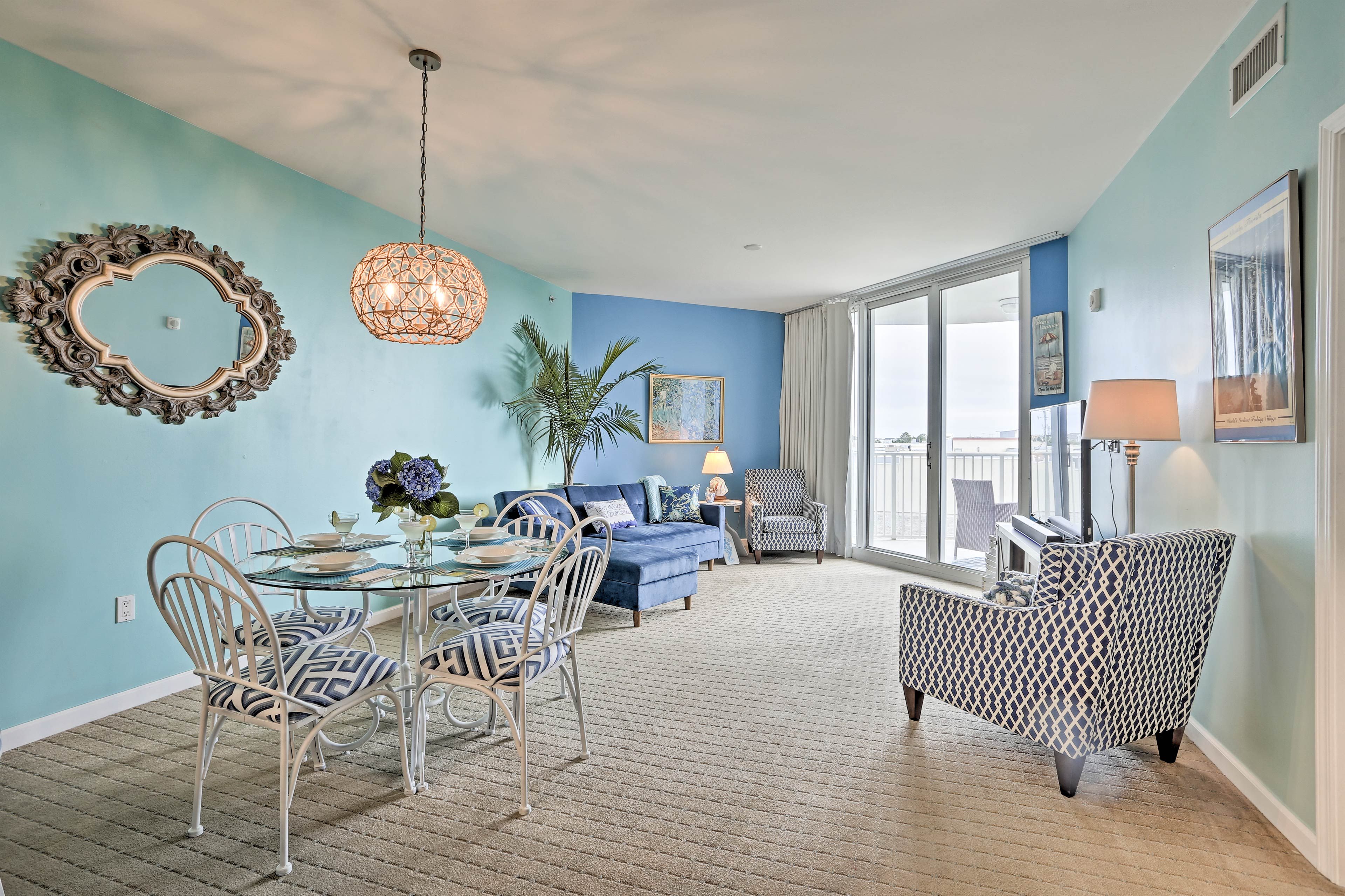 The living space is adorned with tasteful, beachy decor.