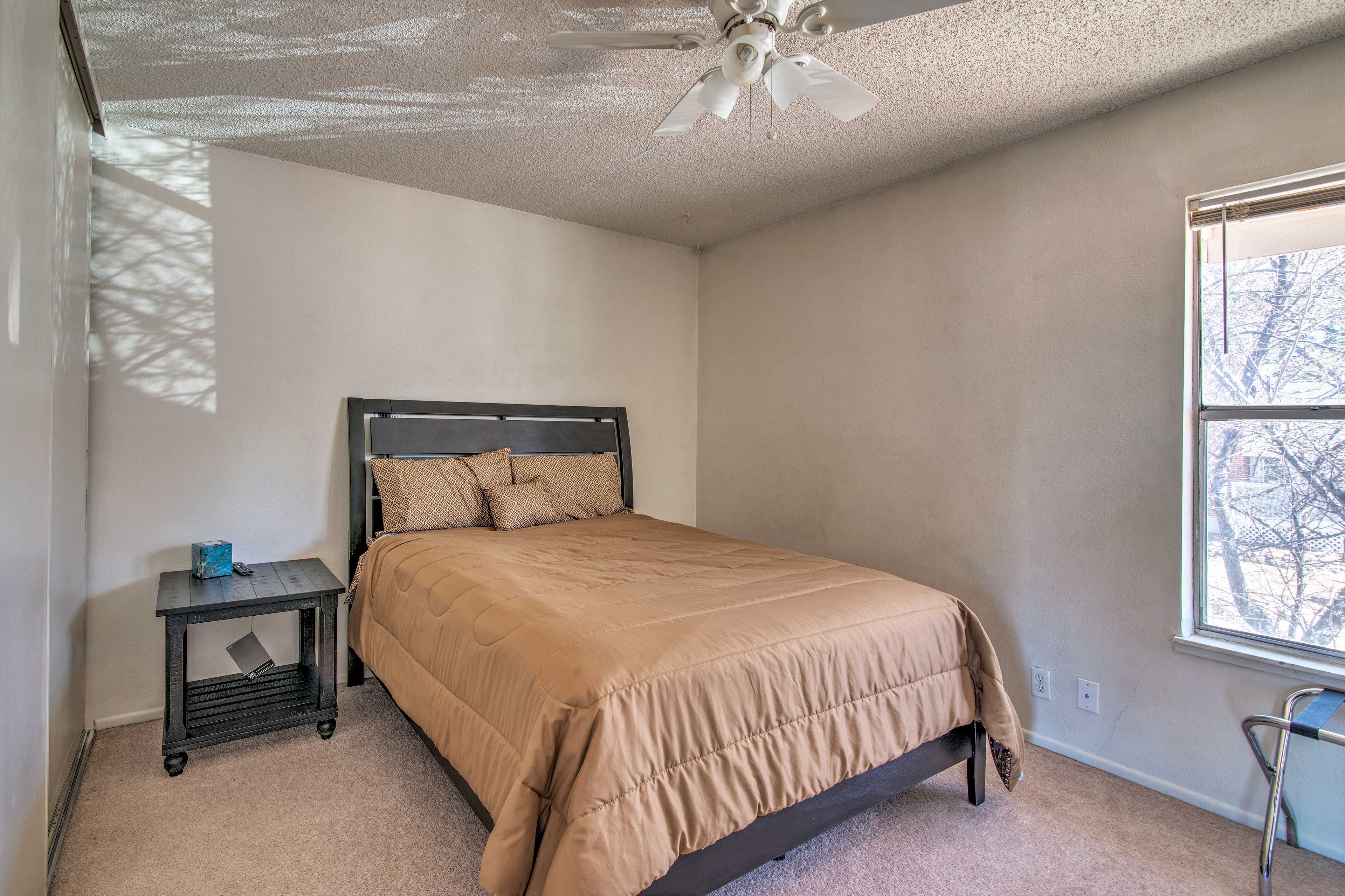 This bedroom includes a queen-sized bed.