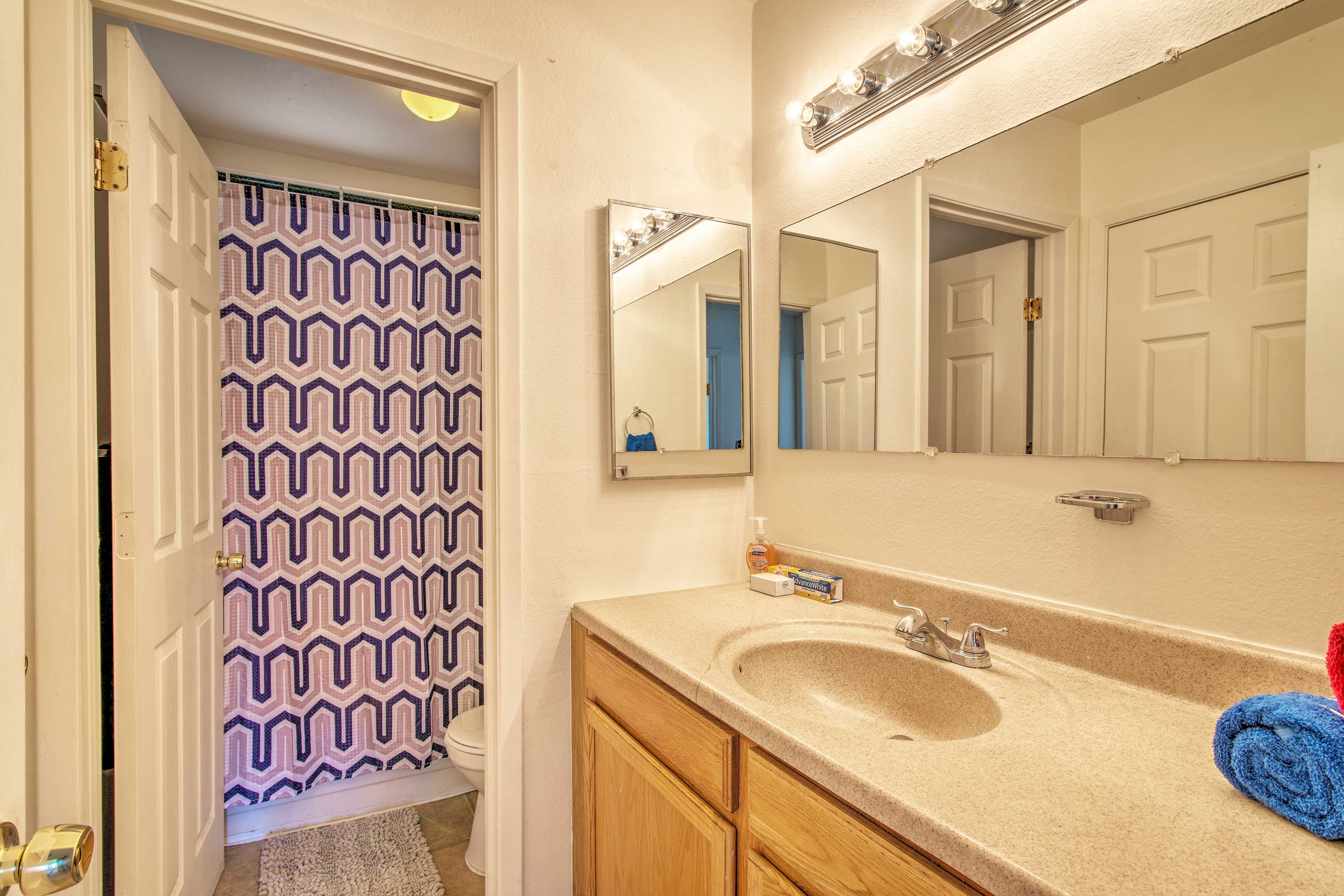Fresh towels are provided in the full bathroom.