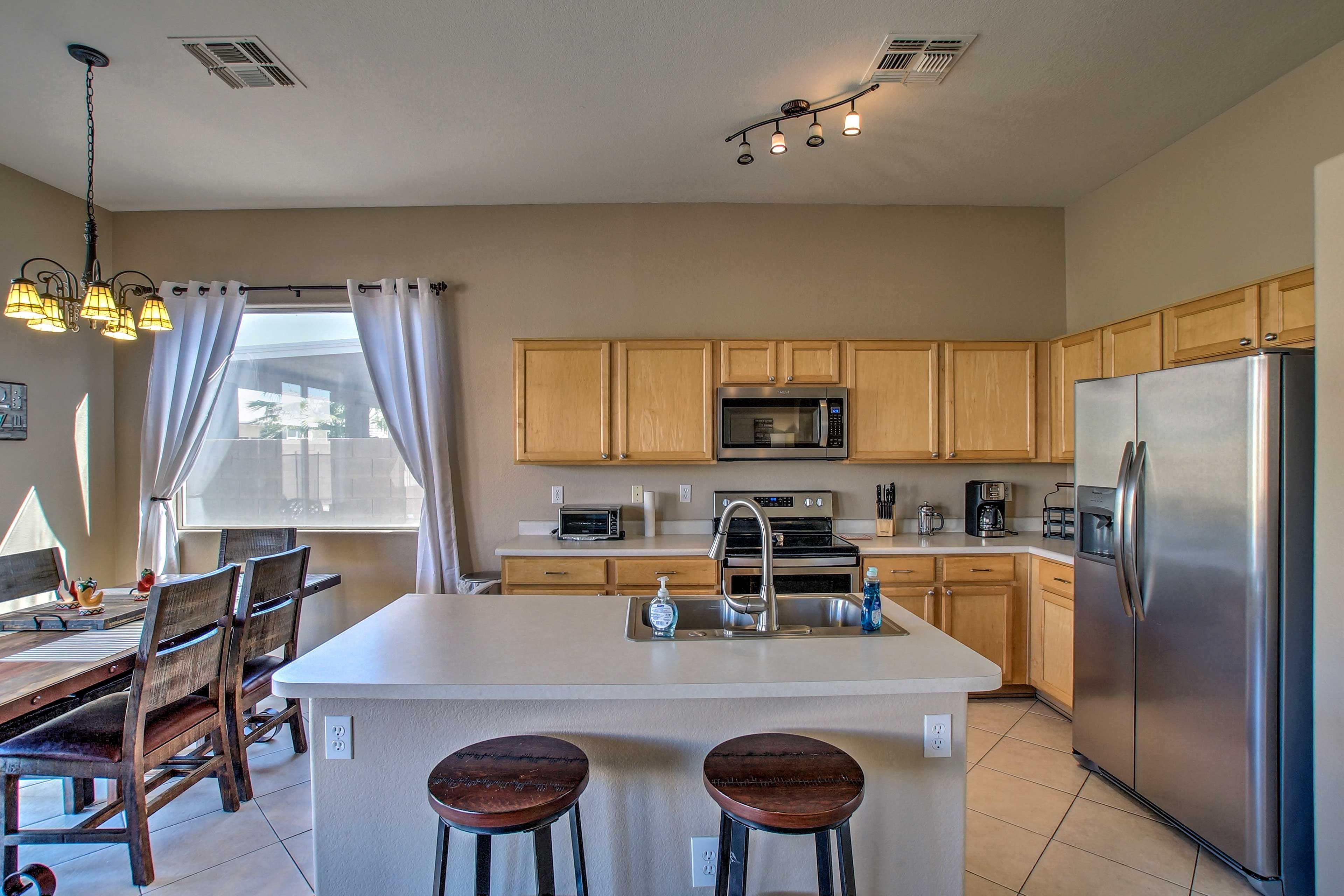 The large island adds counter space and seating for 2.