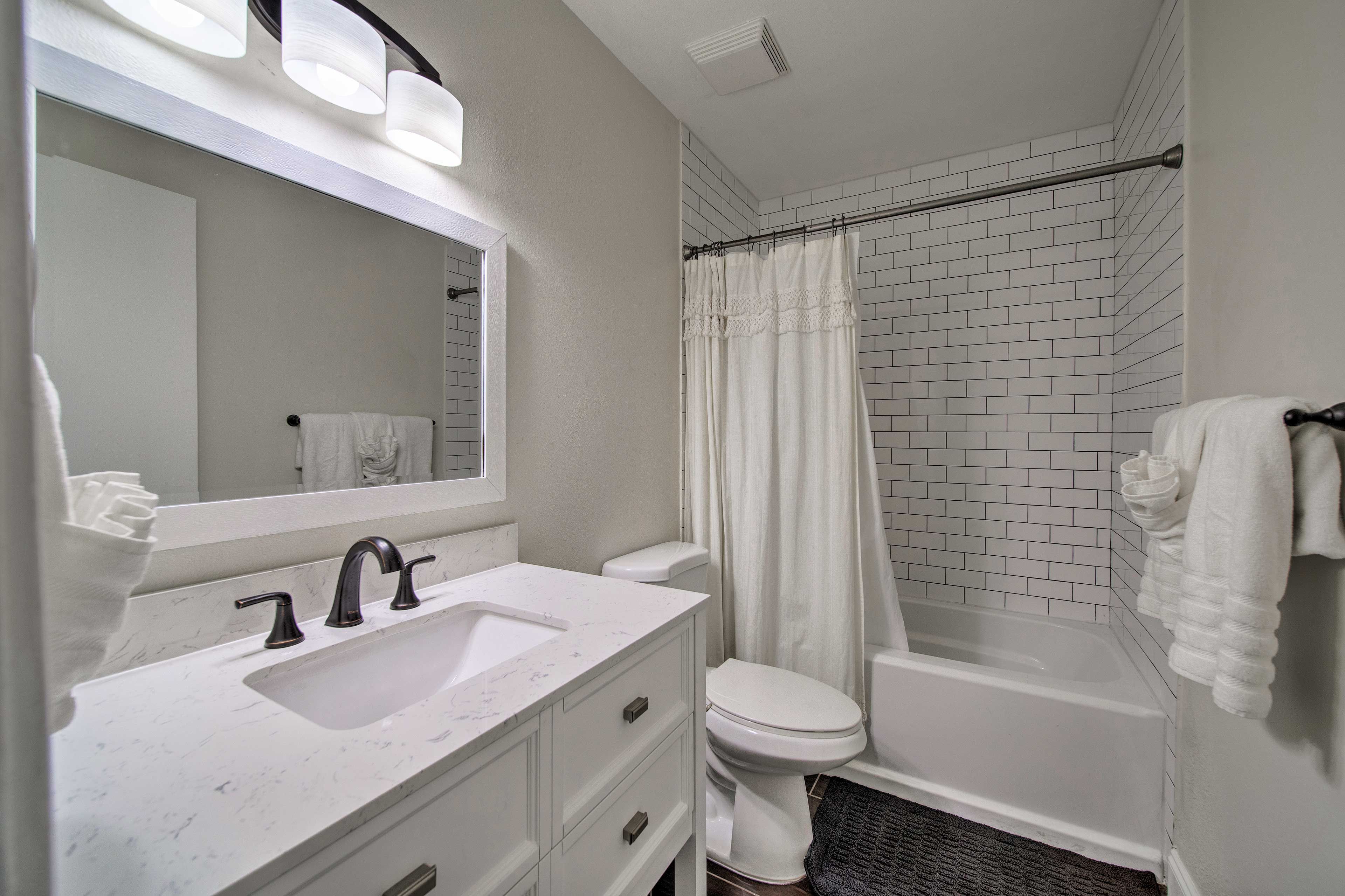 A second full bathroom offers added privacy and a shower/tub combo.
