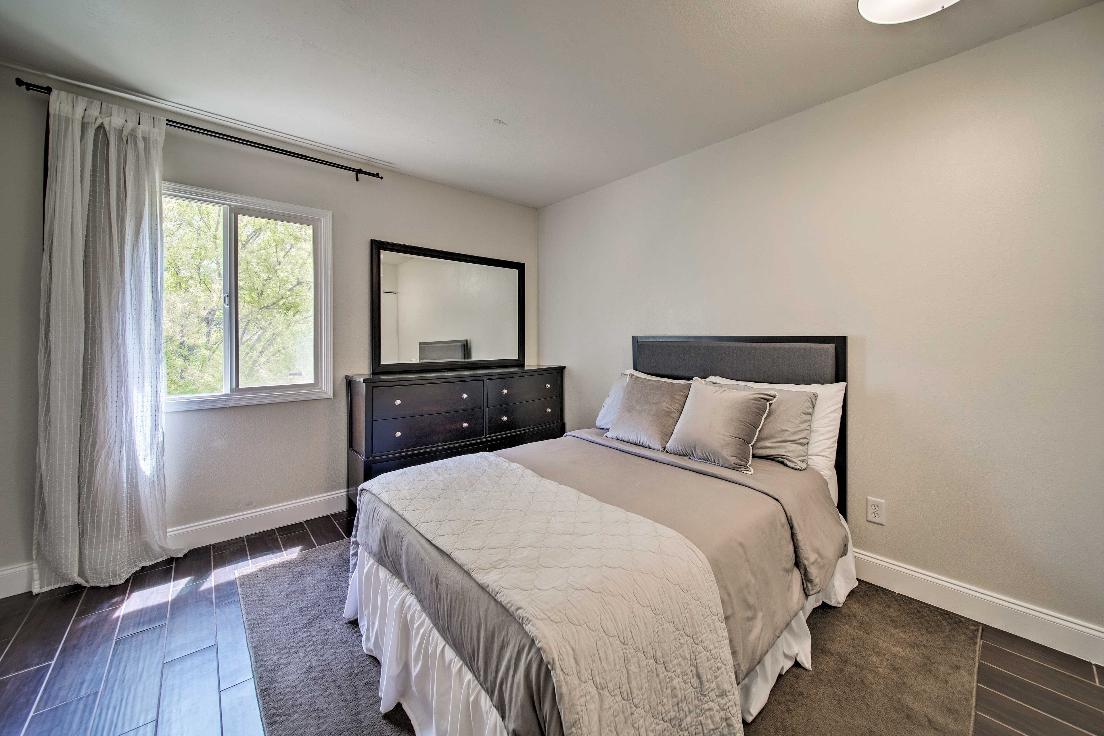 The third bedroom has more space and a large dresser.