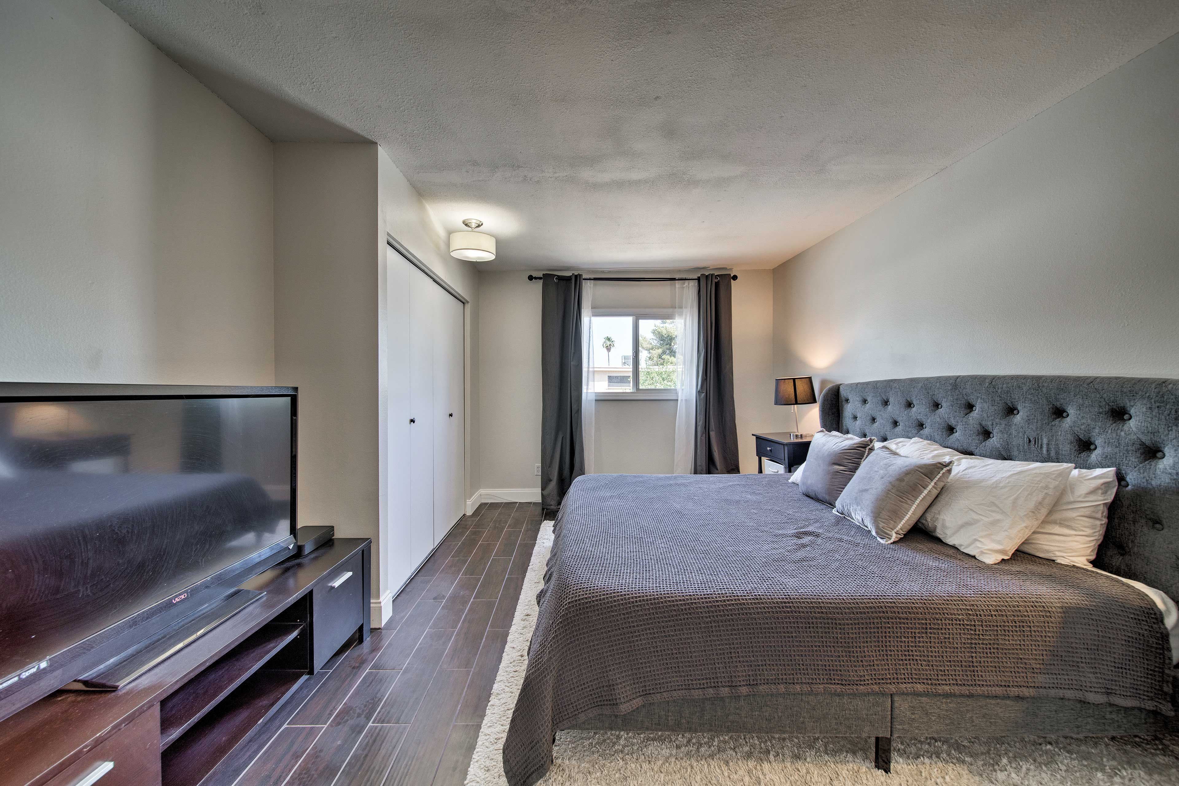 This bedroom has a flat-screen cable TV and plenty of closet space.