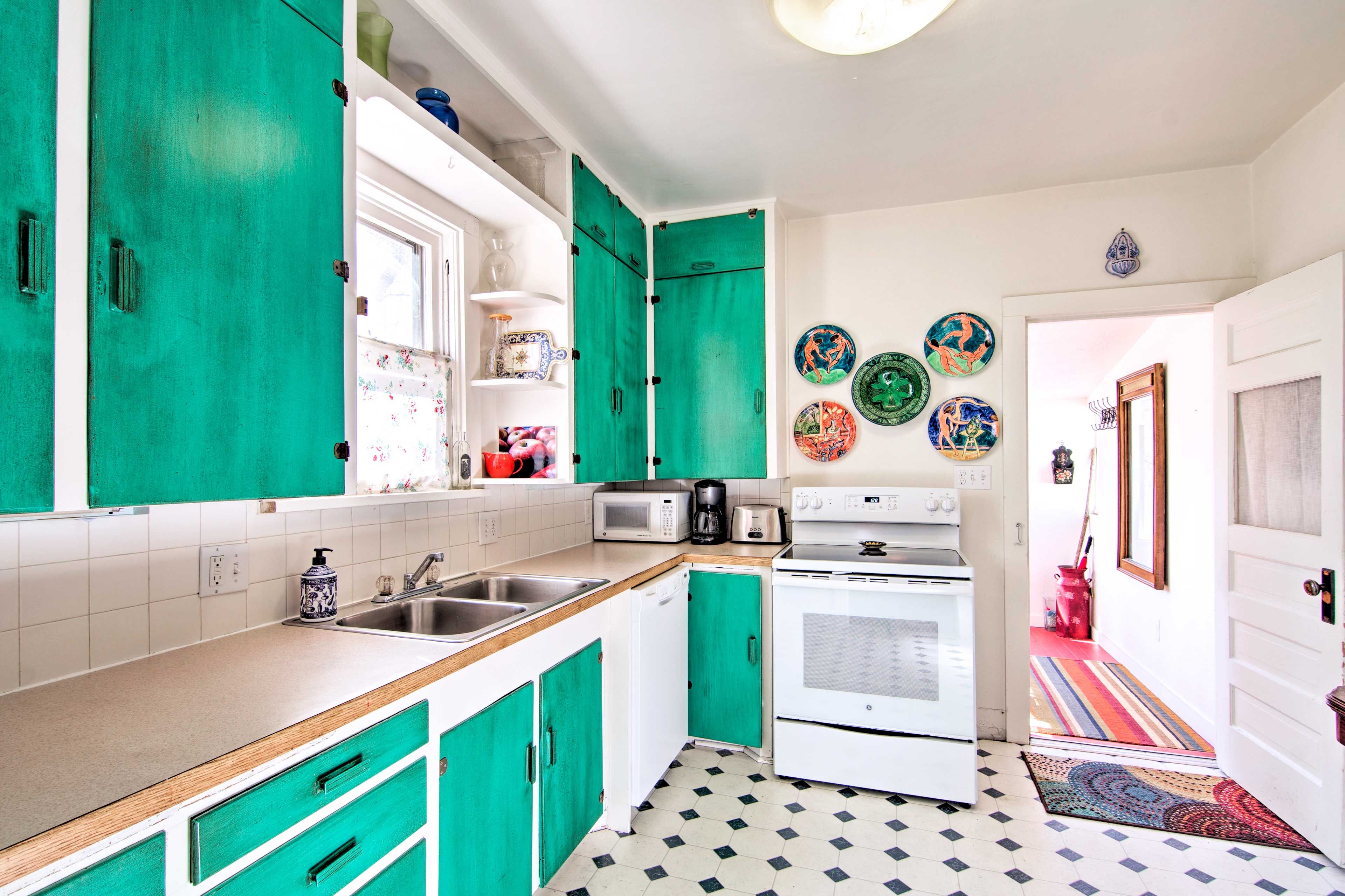 Rustic teal cabinets add a pop of color in the kitchen.