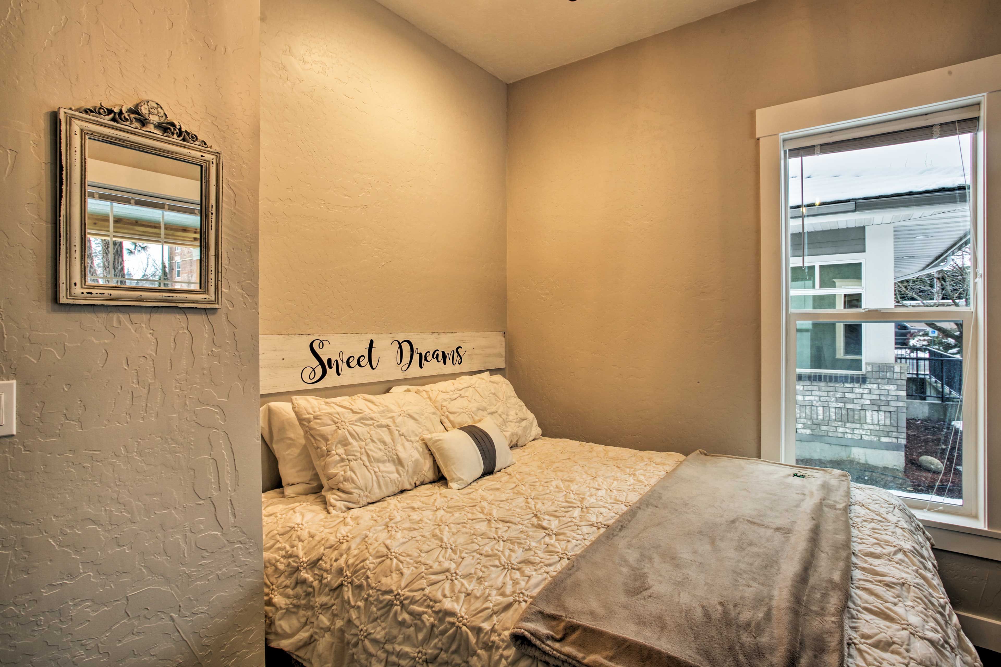 Drift to sleep in this queen bed.