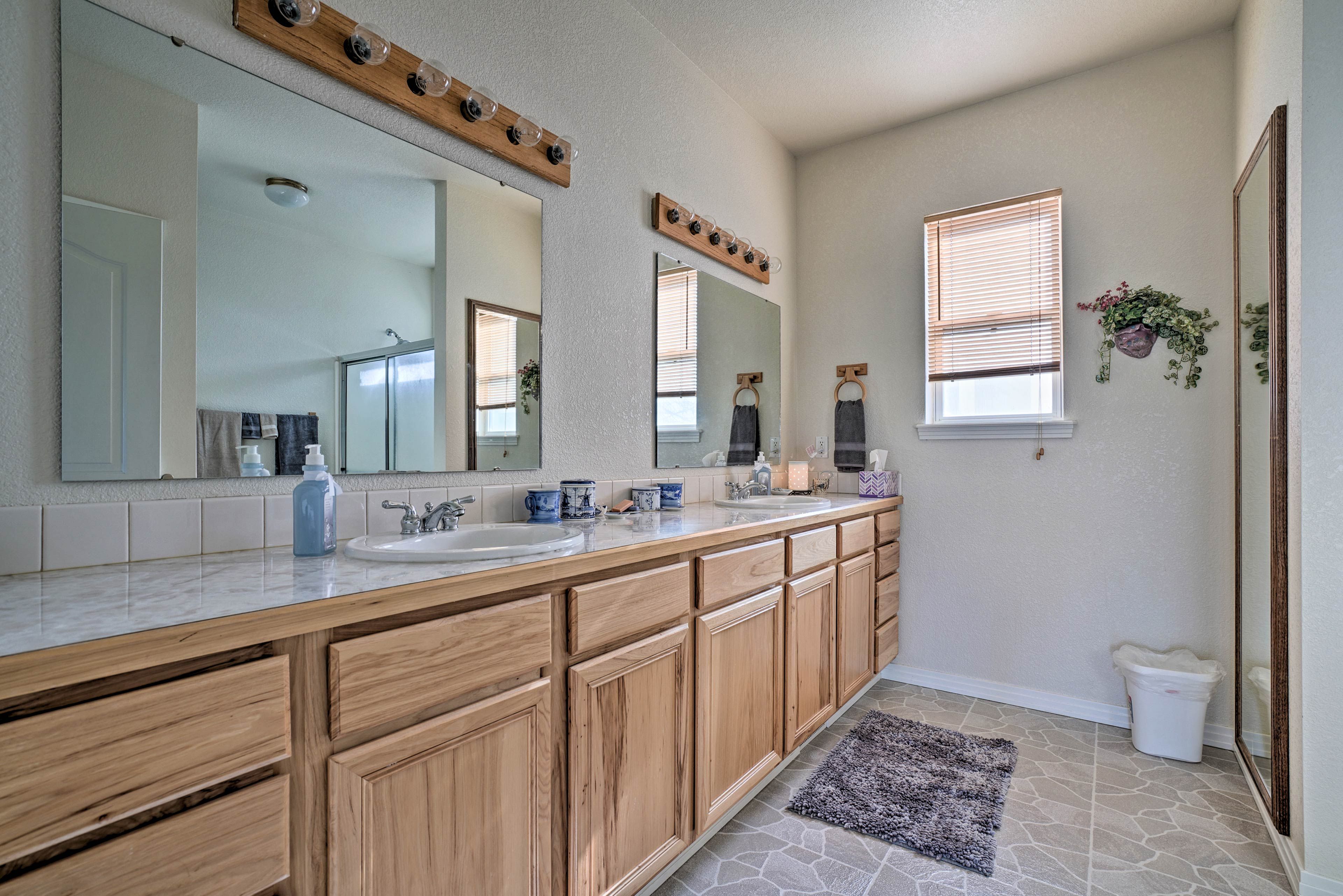 The en-suite bathroom features a double vanity and walk-in shower.