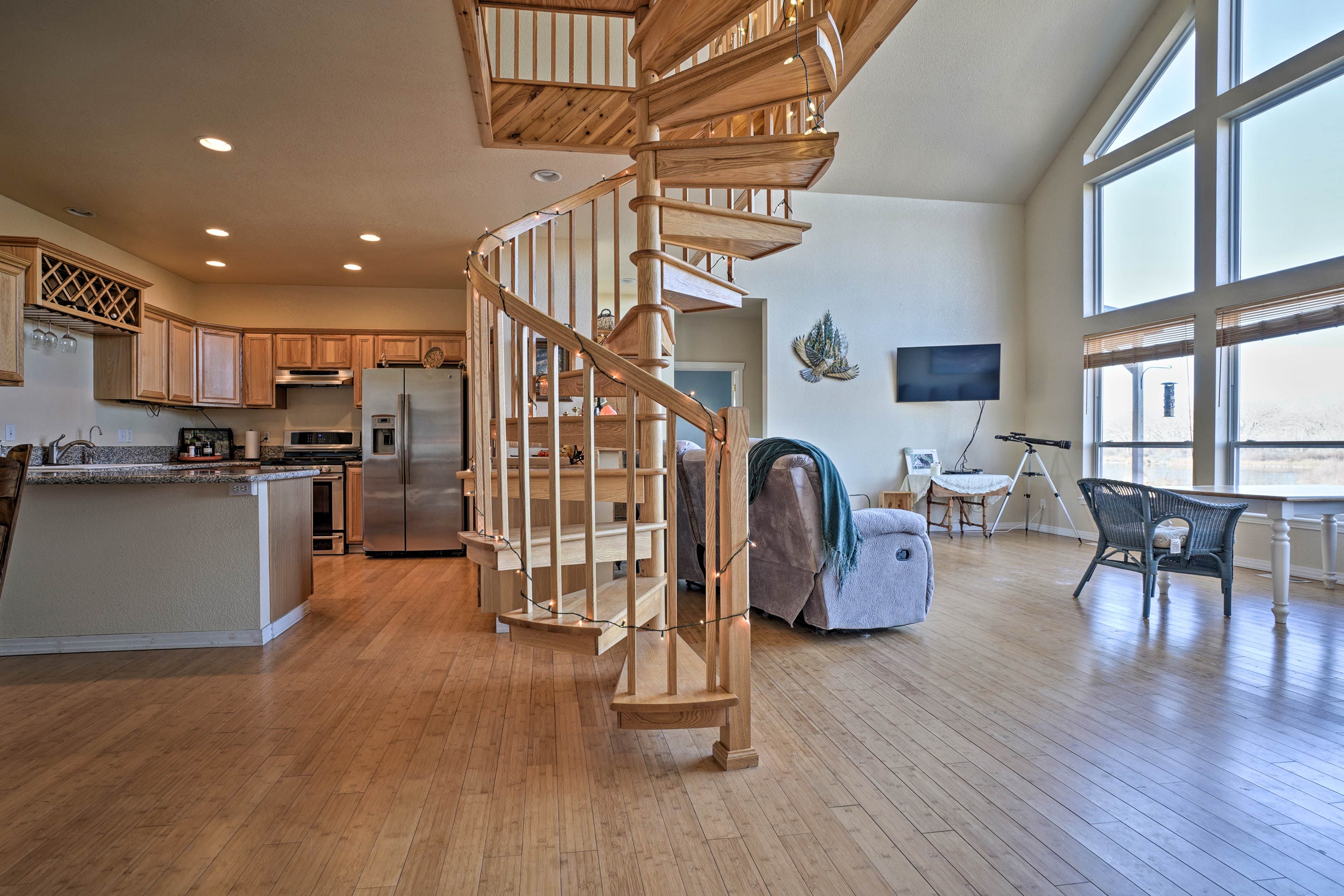 A spiral staircase leads to the loft.