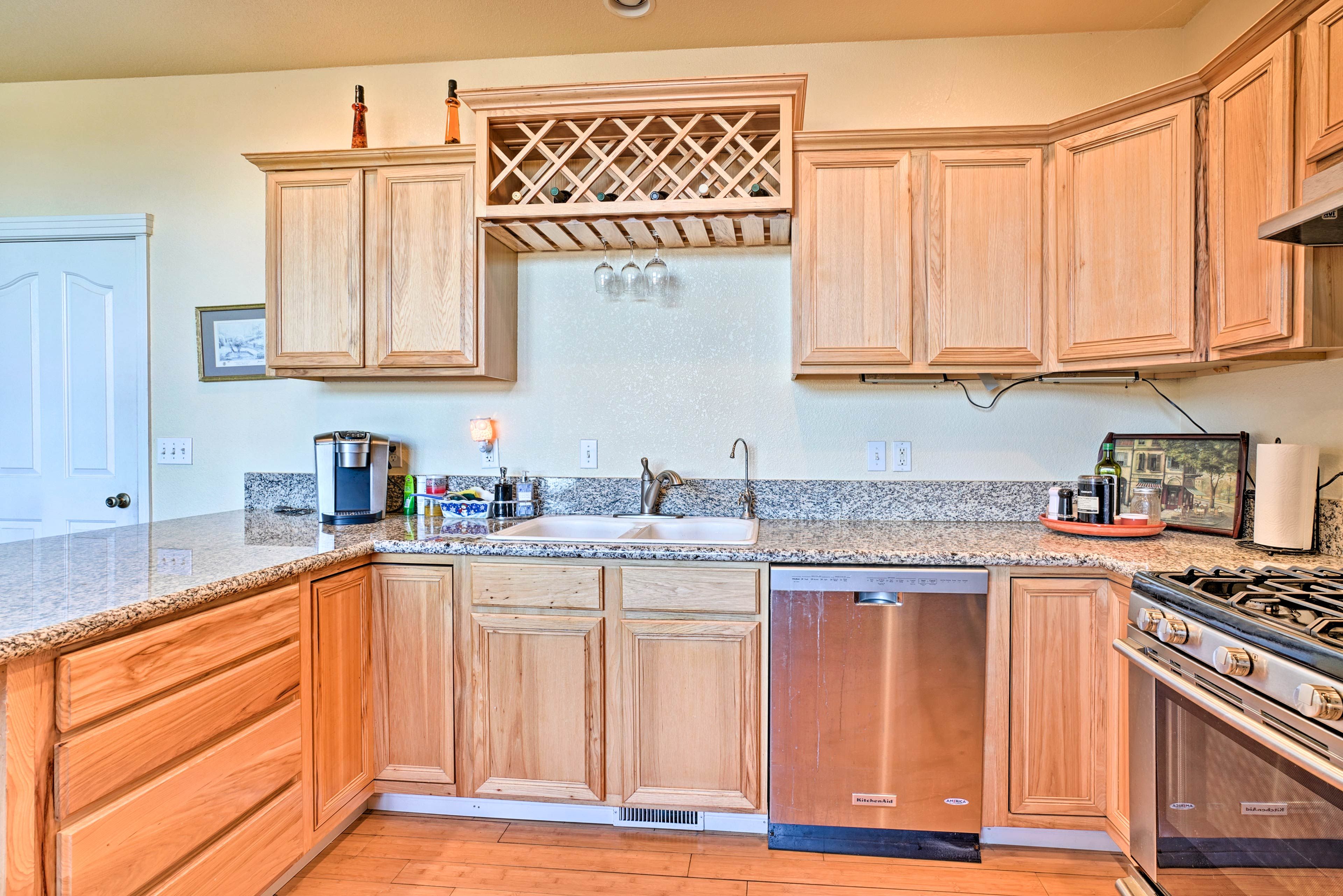 The kitchen is fully equipped with stainless steel appliances.