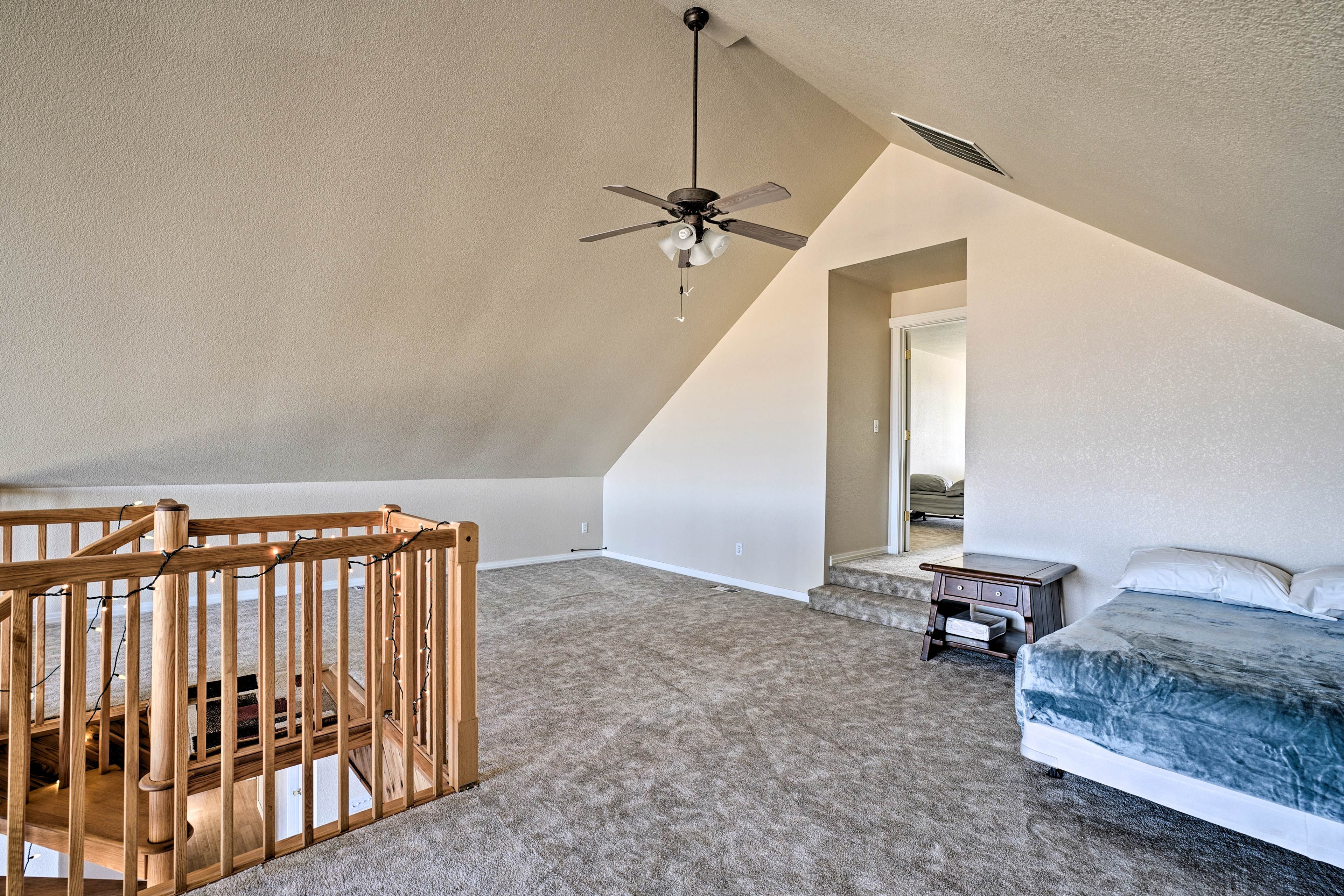 The loft is equipped with a queen bed.