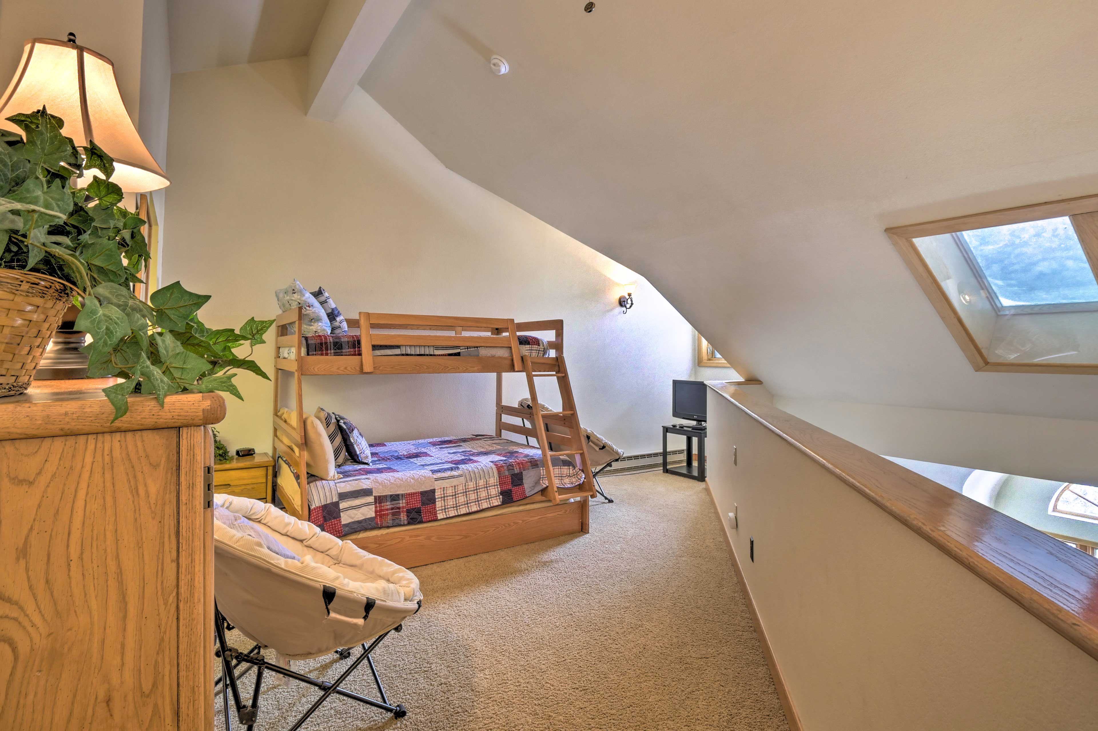 The loft accommodates 4 guests with a twin-over-full bunk + a twin trundle.