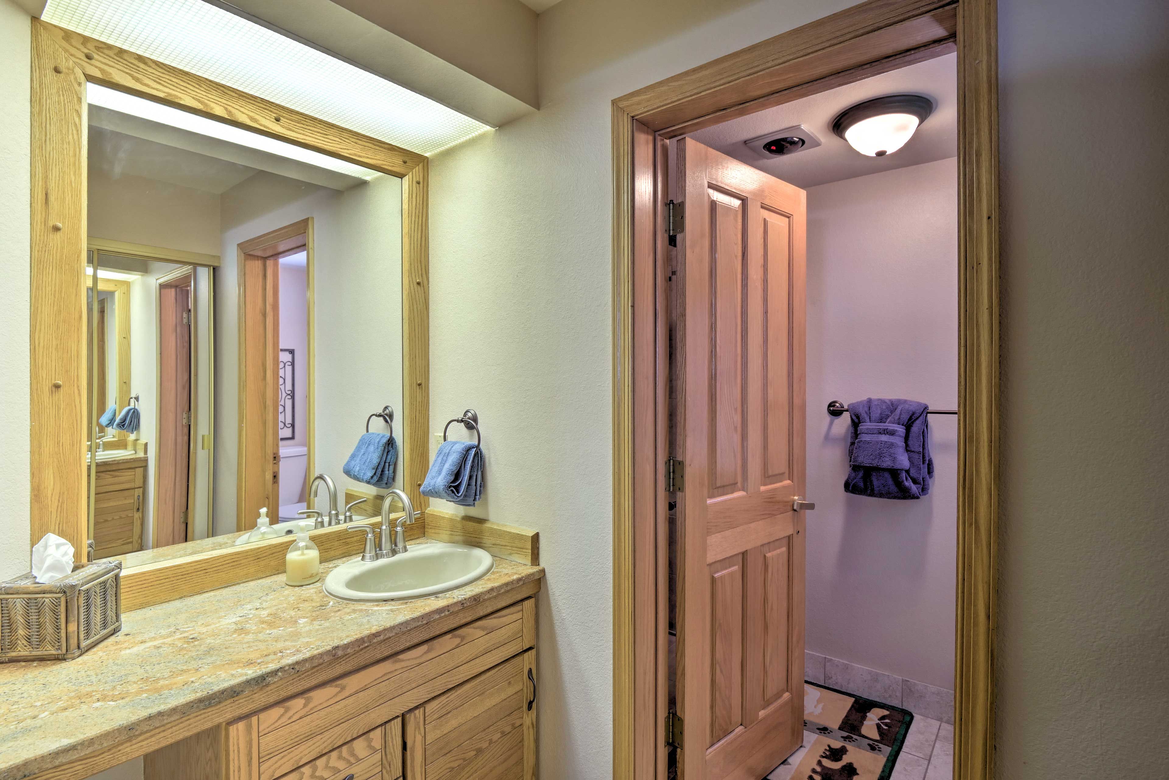The next bathroom is a full with a walk-in shower.