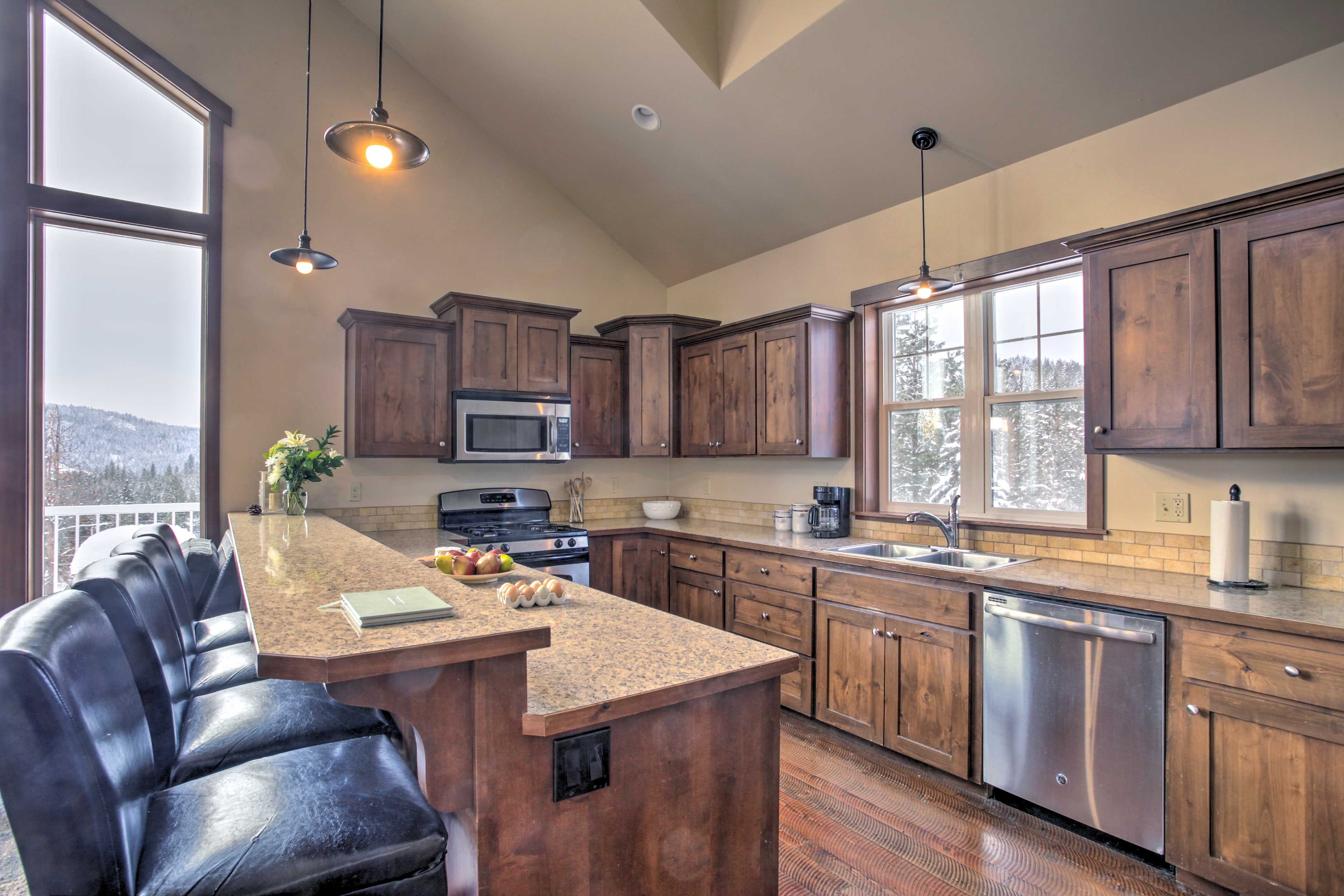 The full equipped kitchen features stainless steel appliances.