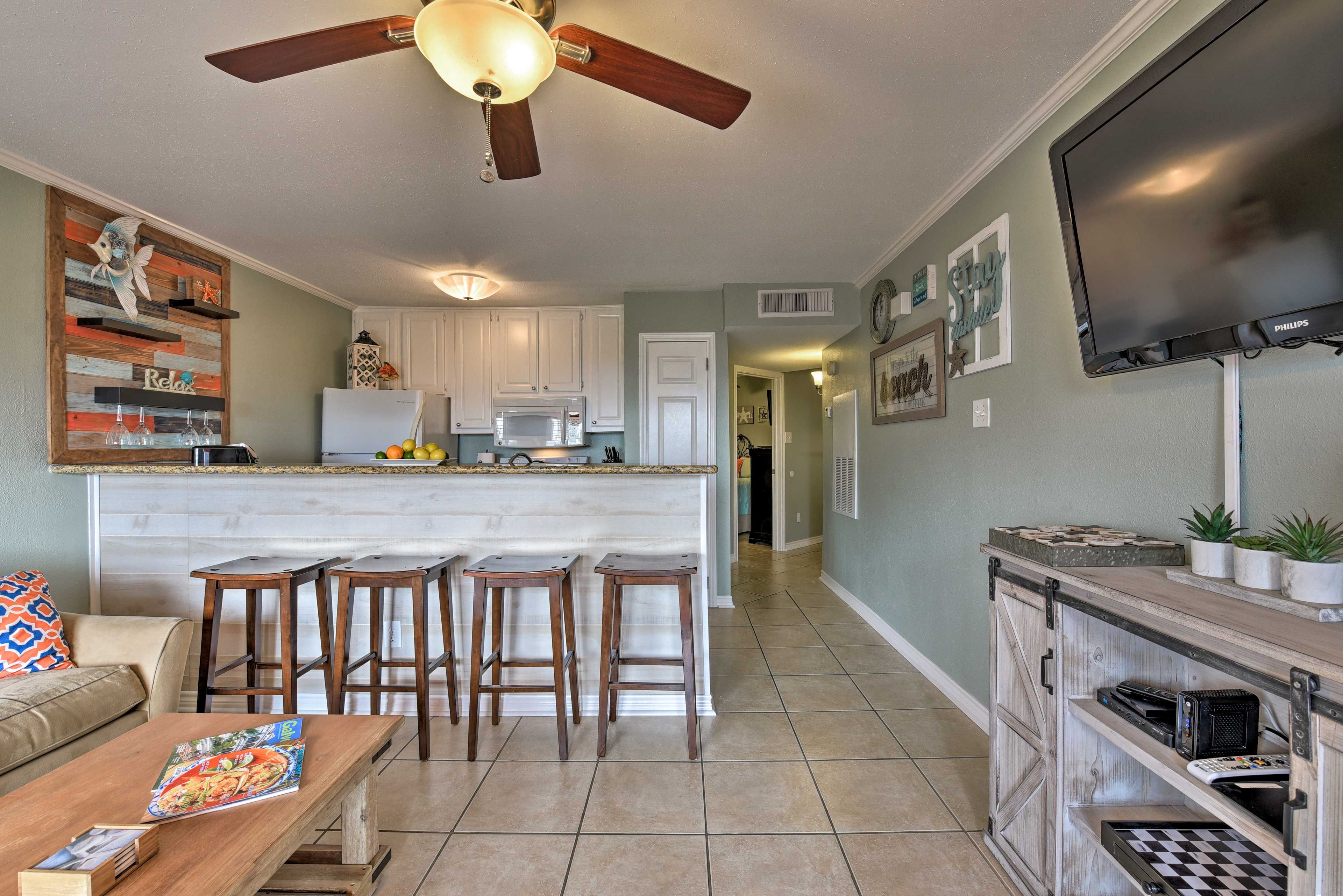 The spacious interior sleeps 6 guests and offers beach-themed decor.