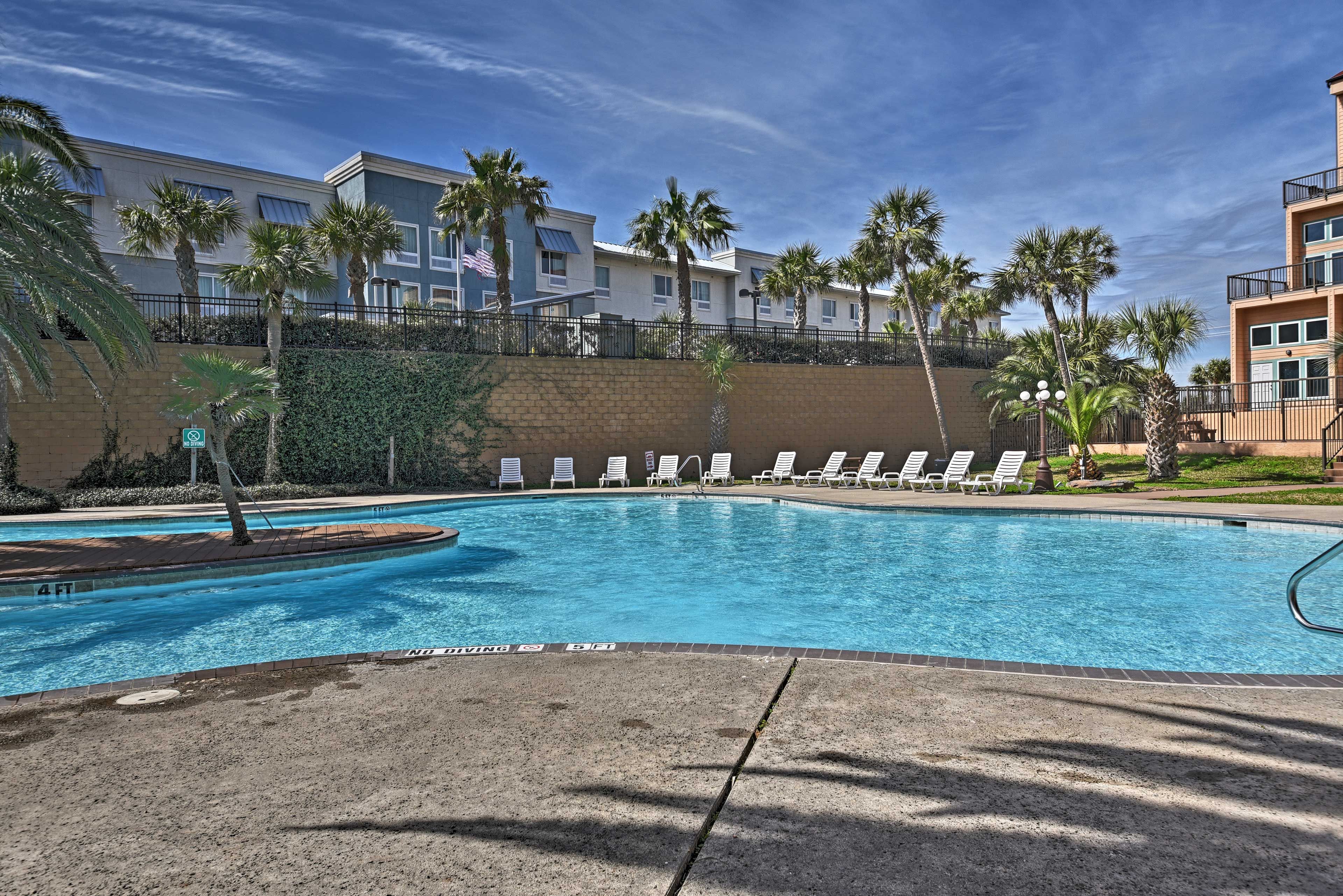 Relax in one of the many sunchairs surrounding the pool.