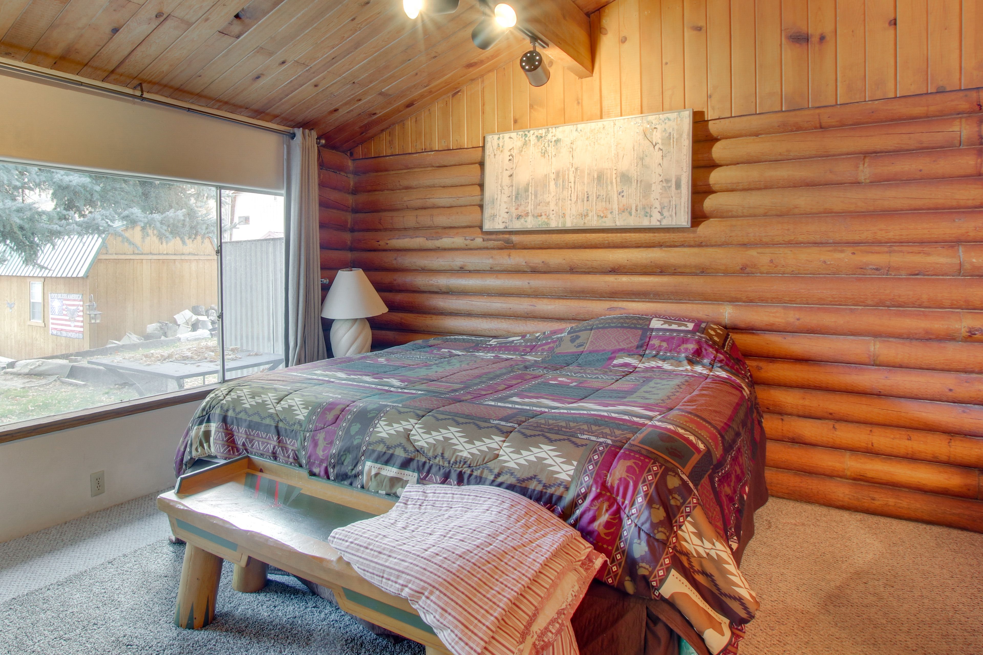 Bedroom 1 | King Bed | Electric Fireplace | Dining Table | En-Suite Bathroom