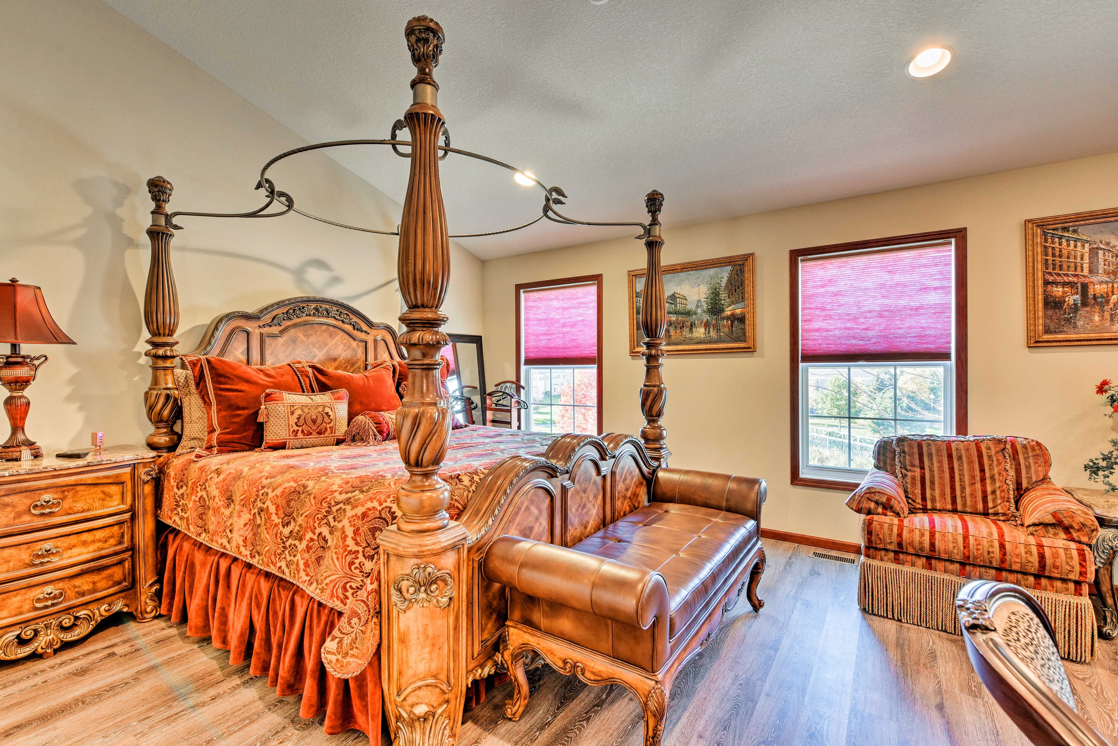 The master bedroom boasts a stylish 4-post bed.