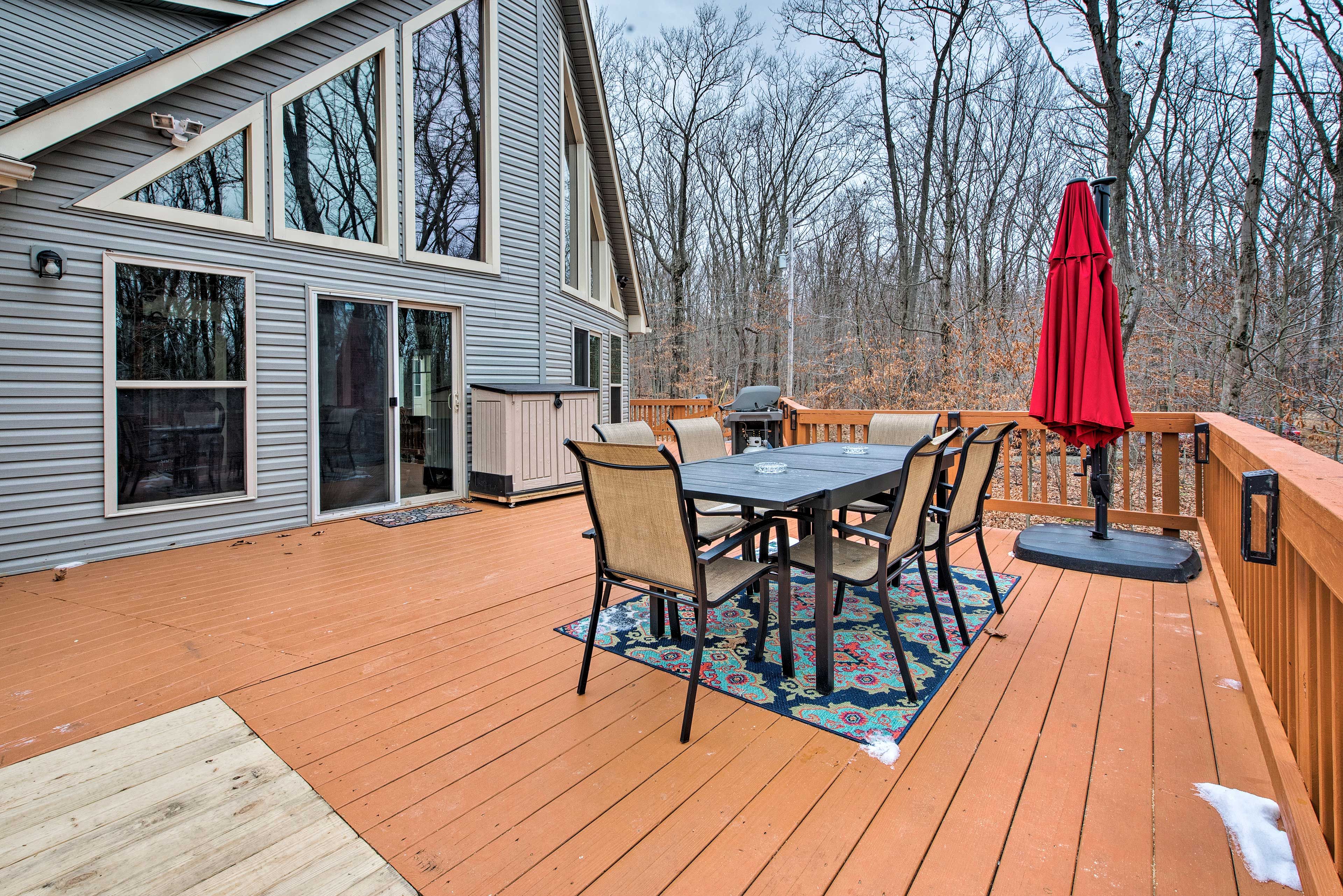 The wraparound deck offers a fire pit, gorgeous views, and new furnishings.