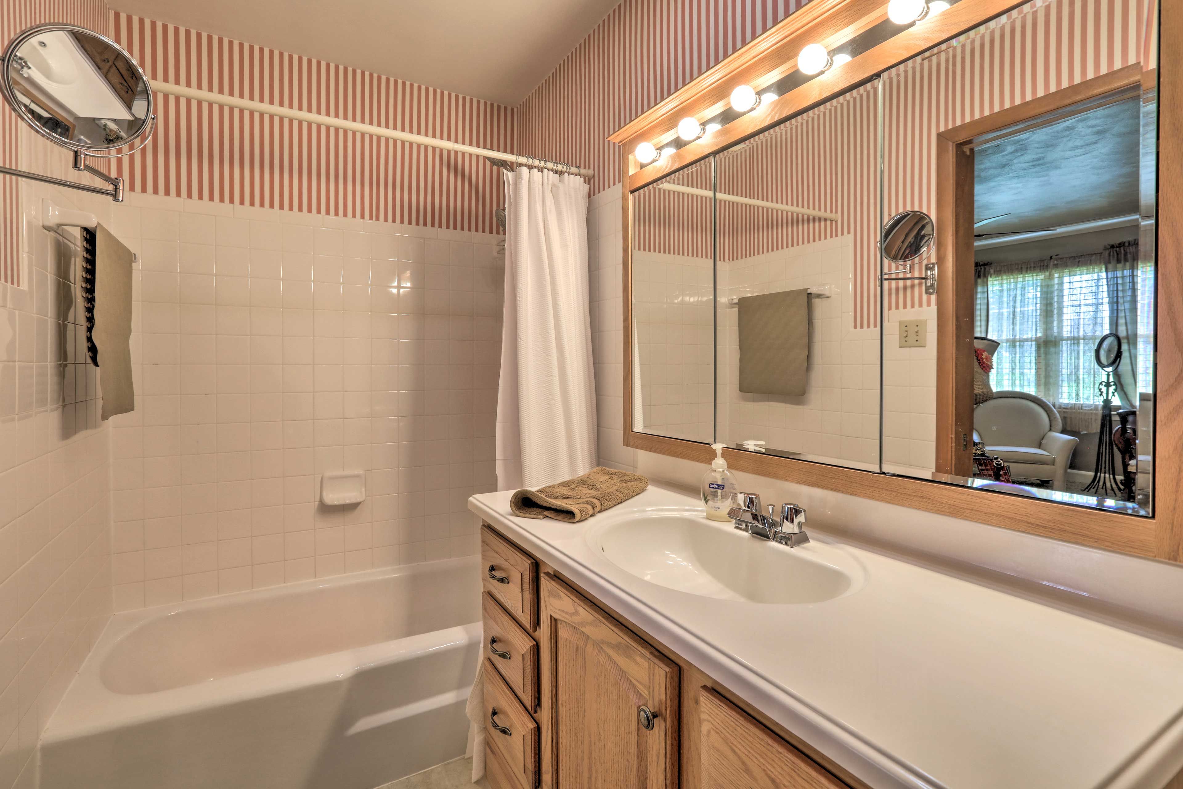 The en-suite bathroom is equipped with a shower/tub combo.