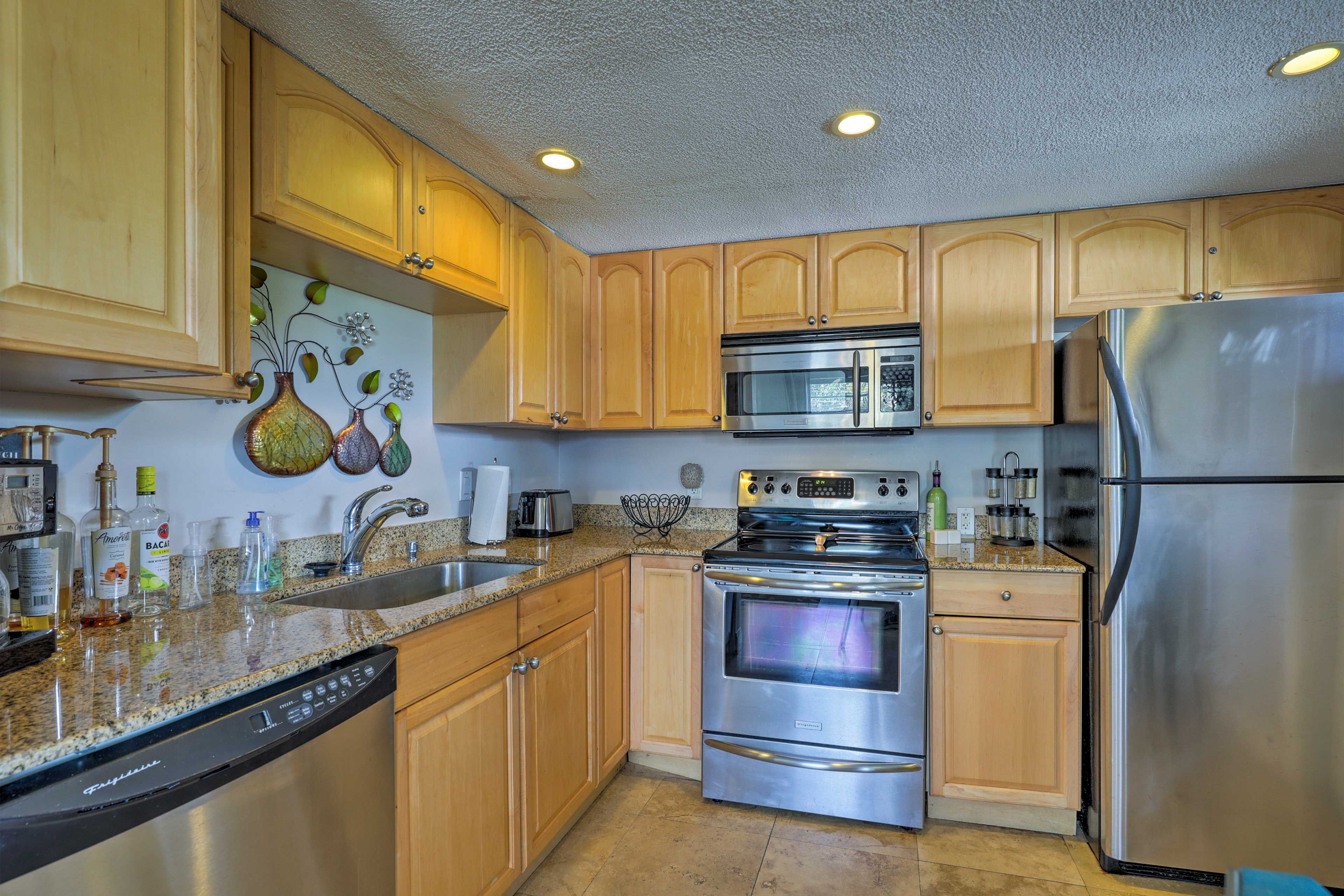 The fully equipped kitchen boasts beautiful granite countertops.