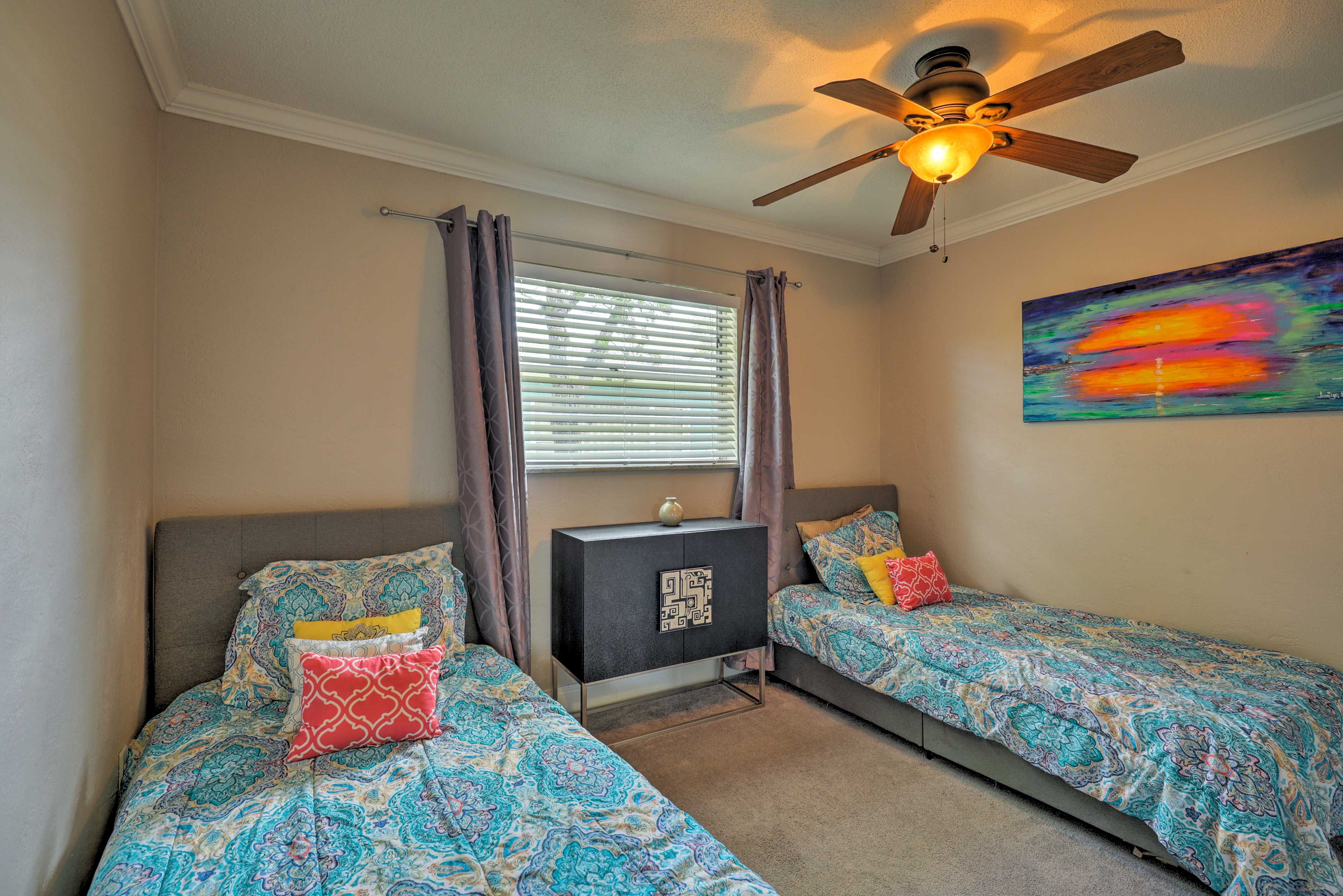 Tuck the kids into the 2 twin beds in this room.