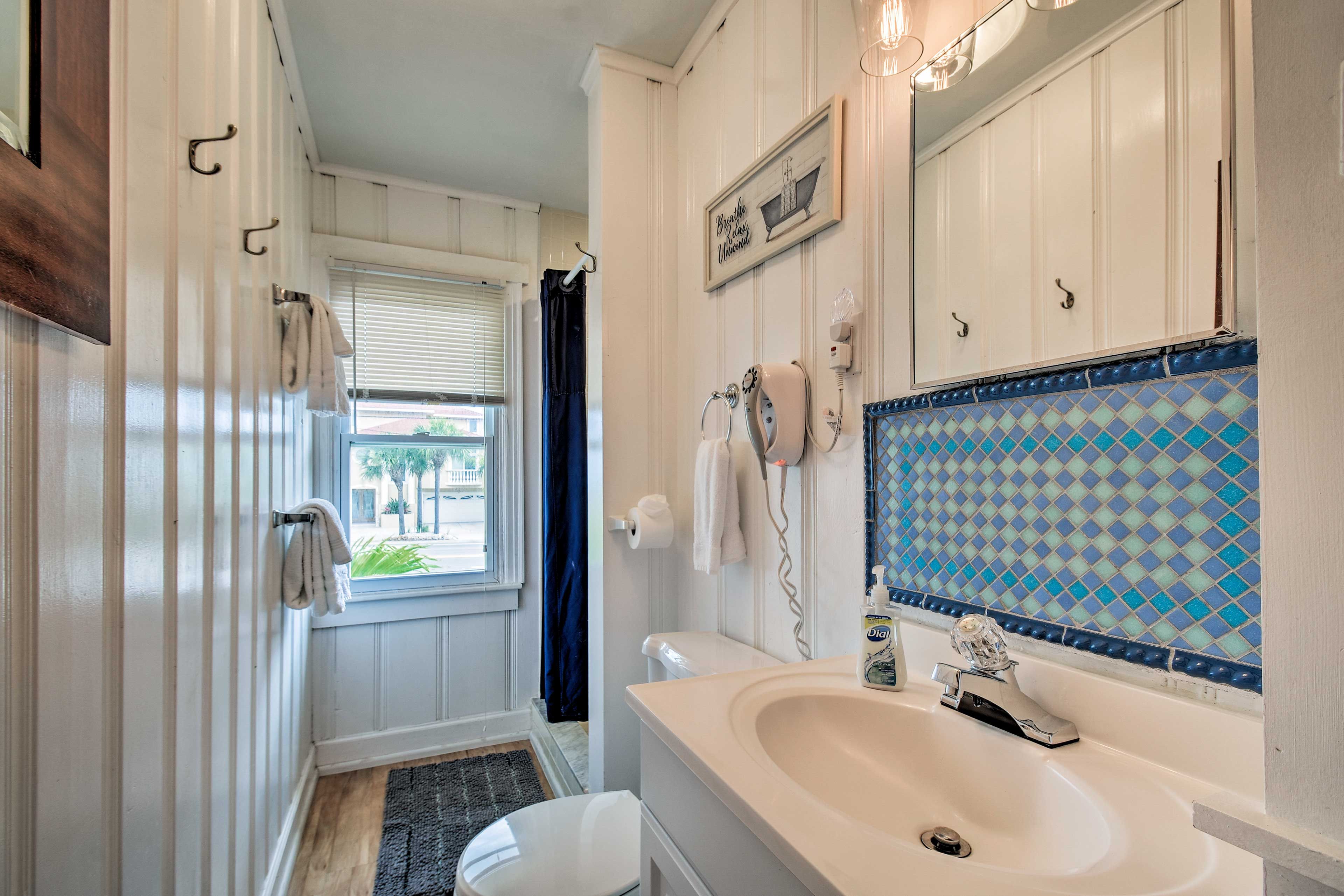Wash off the saltwater in this bathroom, which features a walk-in shower.