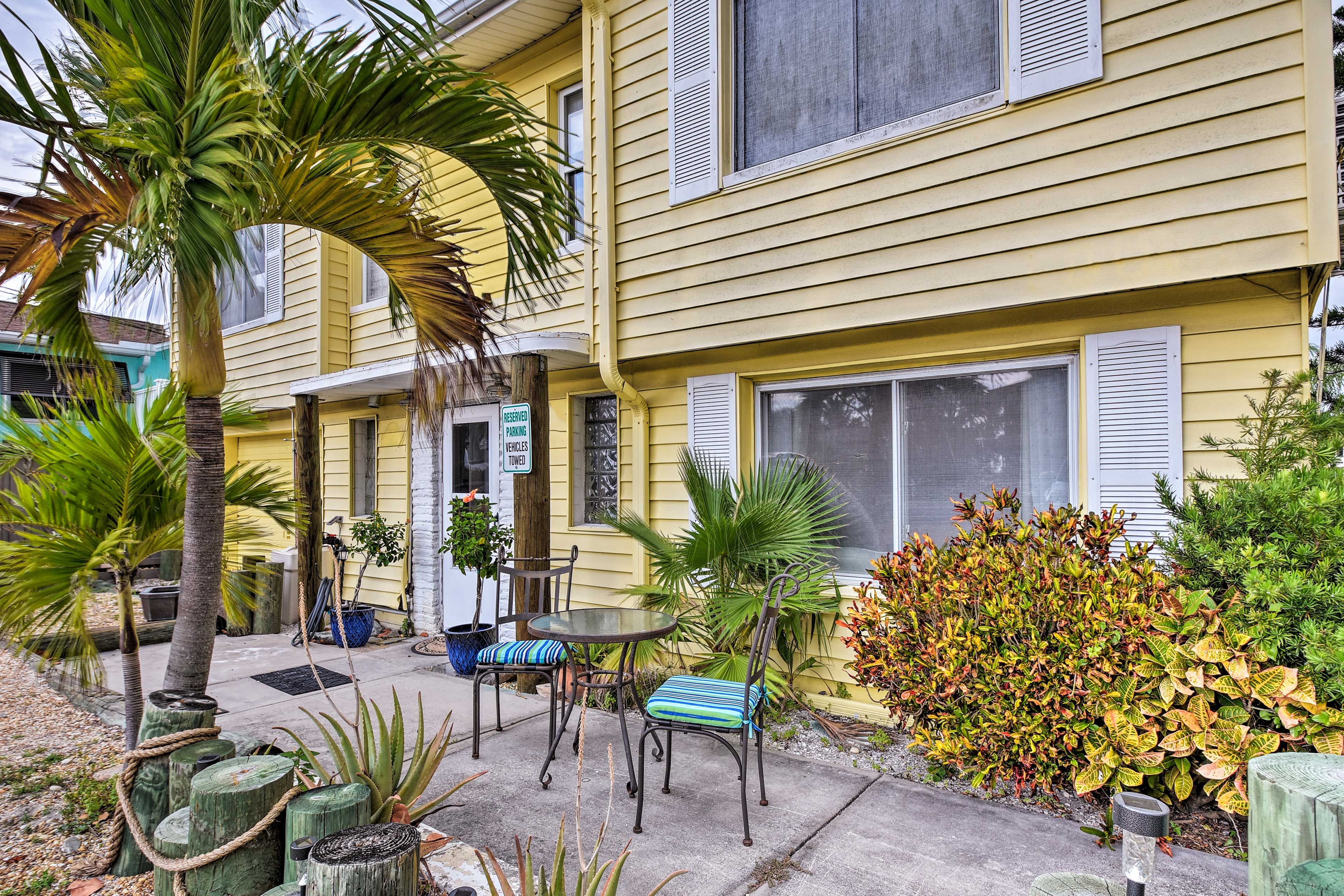Lush greenery invites you to this home.
