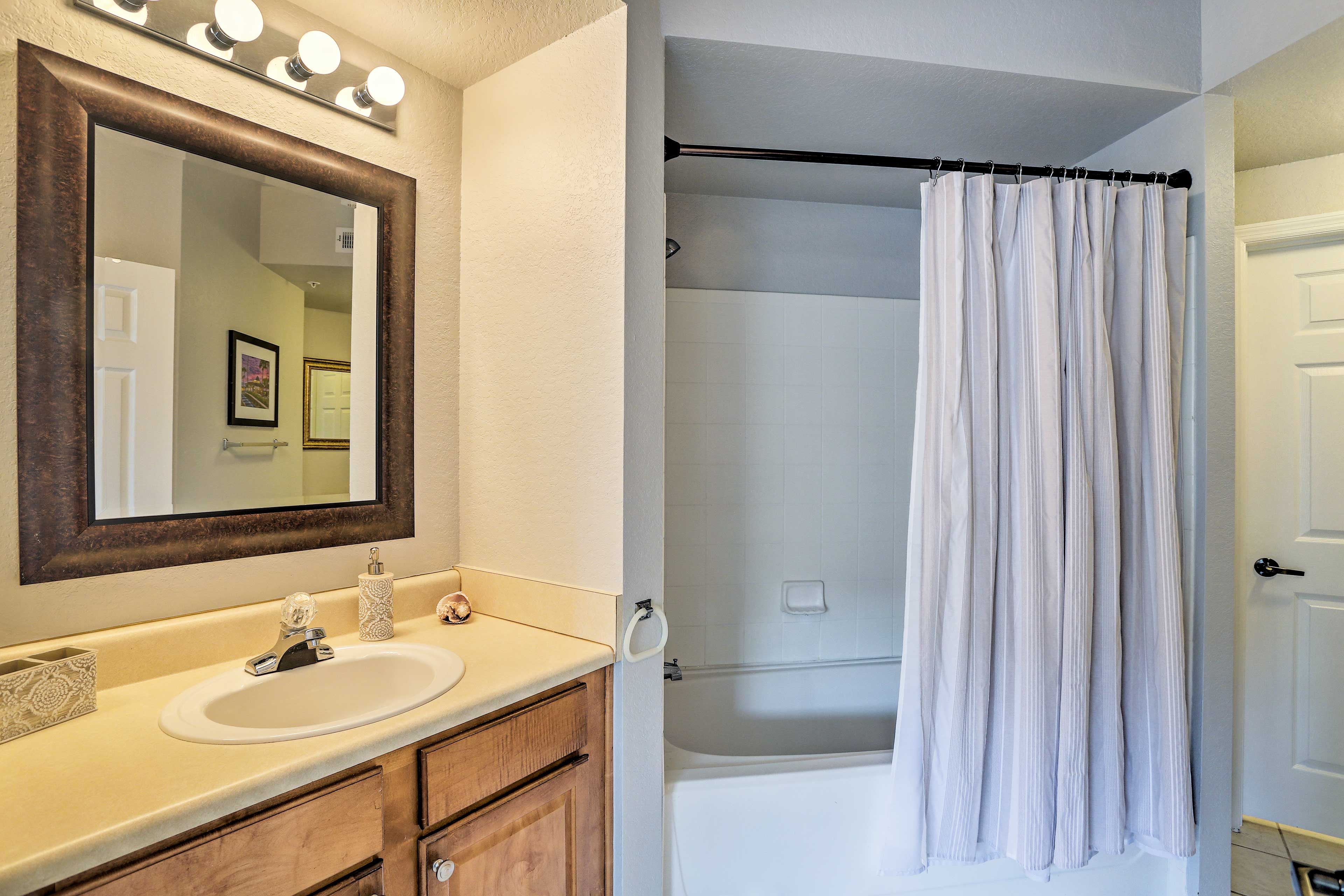 Rinse off in the shower/tub combo in this bathroom.